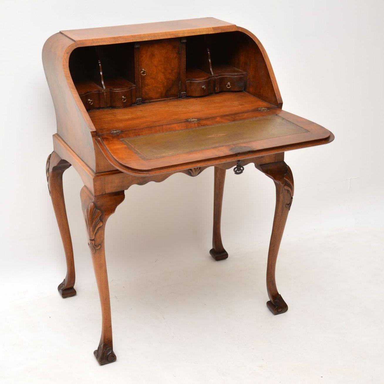 Beautifully shaped antique burr walnut bureau in excellent condition and dating from the 1920s period. It has some lovely features and a nice warm color, plus full of character. The outside of the writing surface and the top are both cross banded in