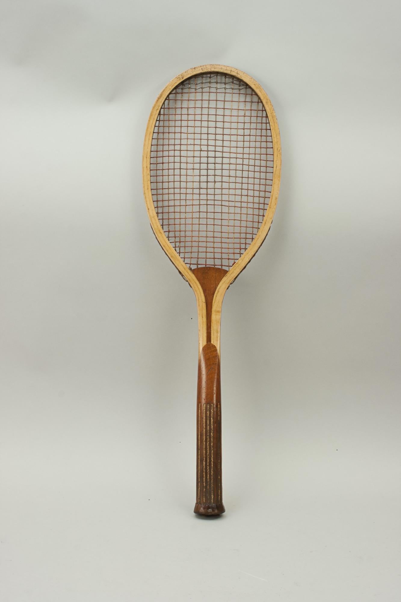 Ash Lawn tennis racket with cork grip.
A very good and collectable lawn tennis racket with unusual patent grip. This style of cork grip is usually found on rackets manufactured by George Bussey & Co., although this racket for some reason does not