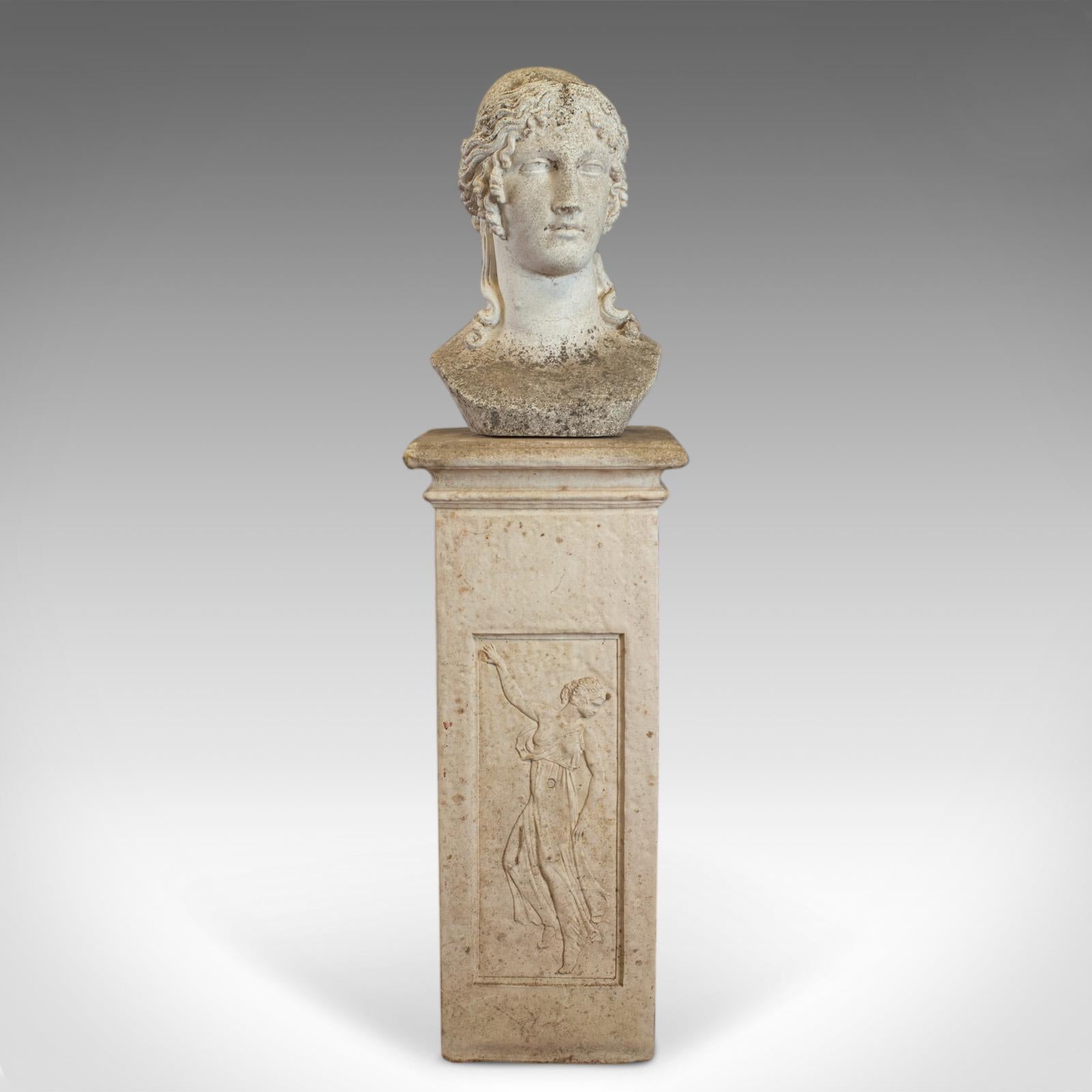 This is an antique bust on pedestal. An Italian, classical revival garden sculpture depicting a female pose. Beautifully formed in reconstituted stone and dating to the early 20th century, circa 1910. 

A detailed bust displaying desirable