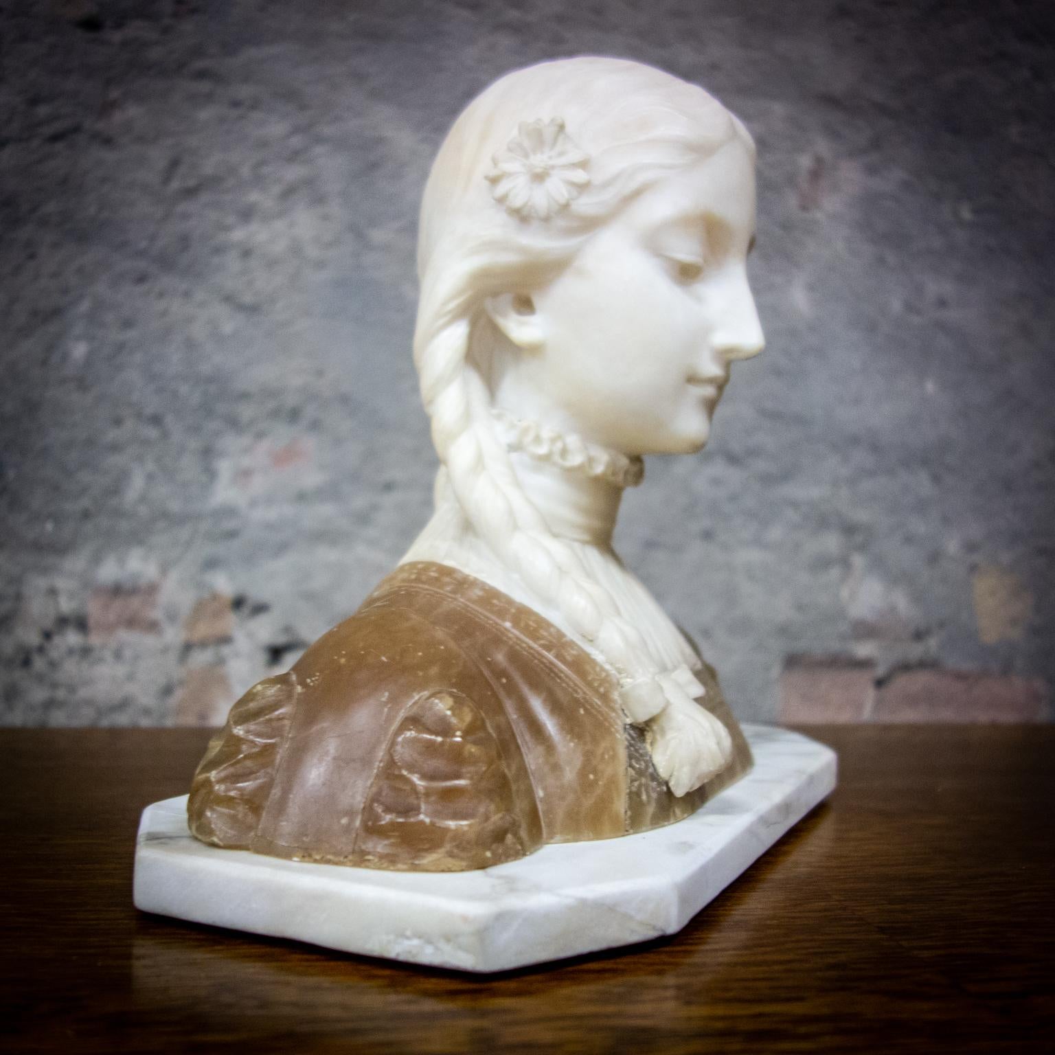 If you can incorporate beauty into marble, you have real talent! This bust comes from France, circa 1880. The statue is in good condition, at the back one tiny loop of the bow is missing (see photos).