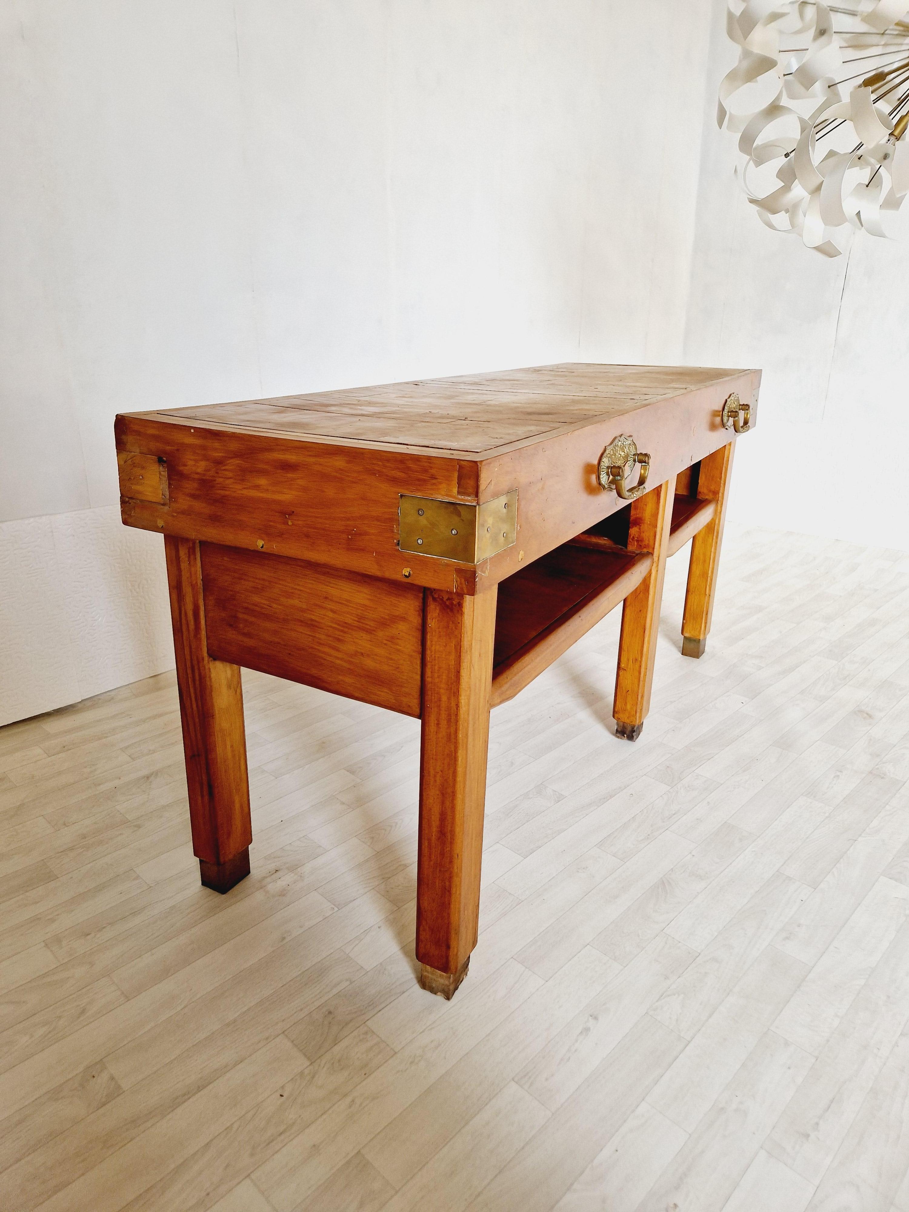 
This antique French butchers block table is an exquisite addition to any kitchen or dining area. Crafted with care in the early 20th century, this freestanding kitchen island features a sturdy pine worktop, measuring 175cm in length and 20cm in