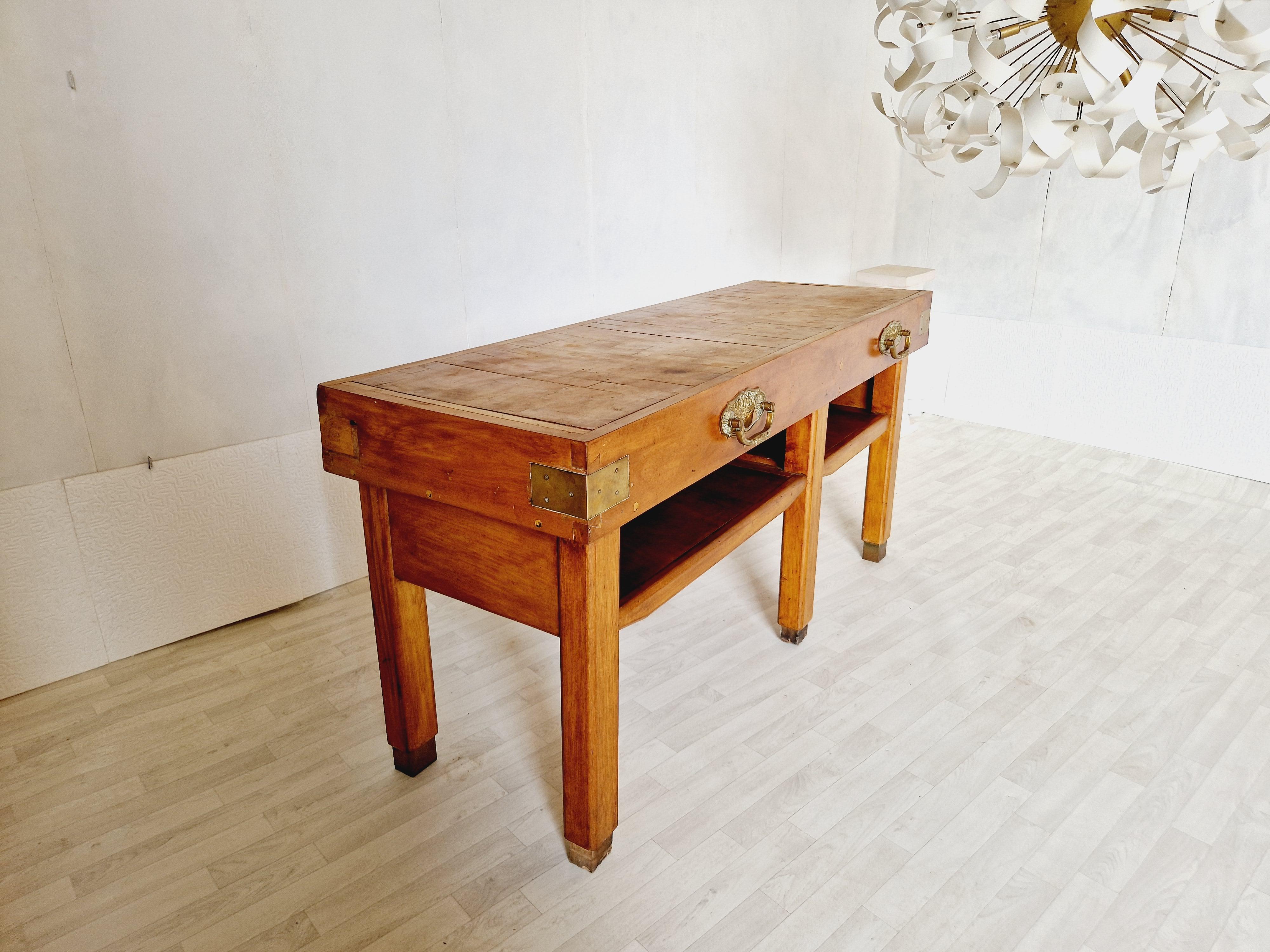 
This antique French butchers block table is an exquisite addition to any kitchen or dining area. Crafted with care in the early 20th century, this freestanding kitchen island features a sturdy pine worktop, measuring 175cm in length and 20cm in