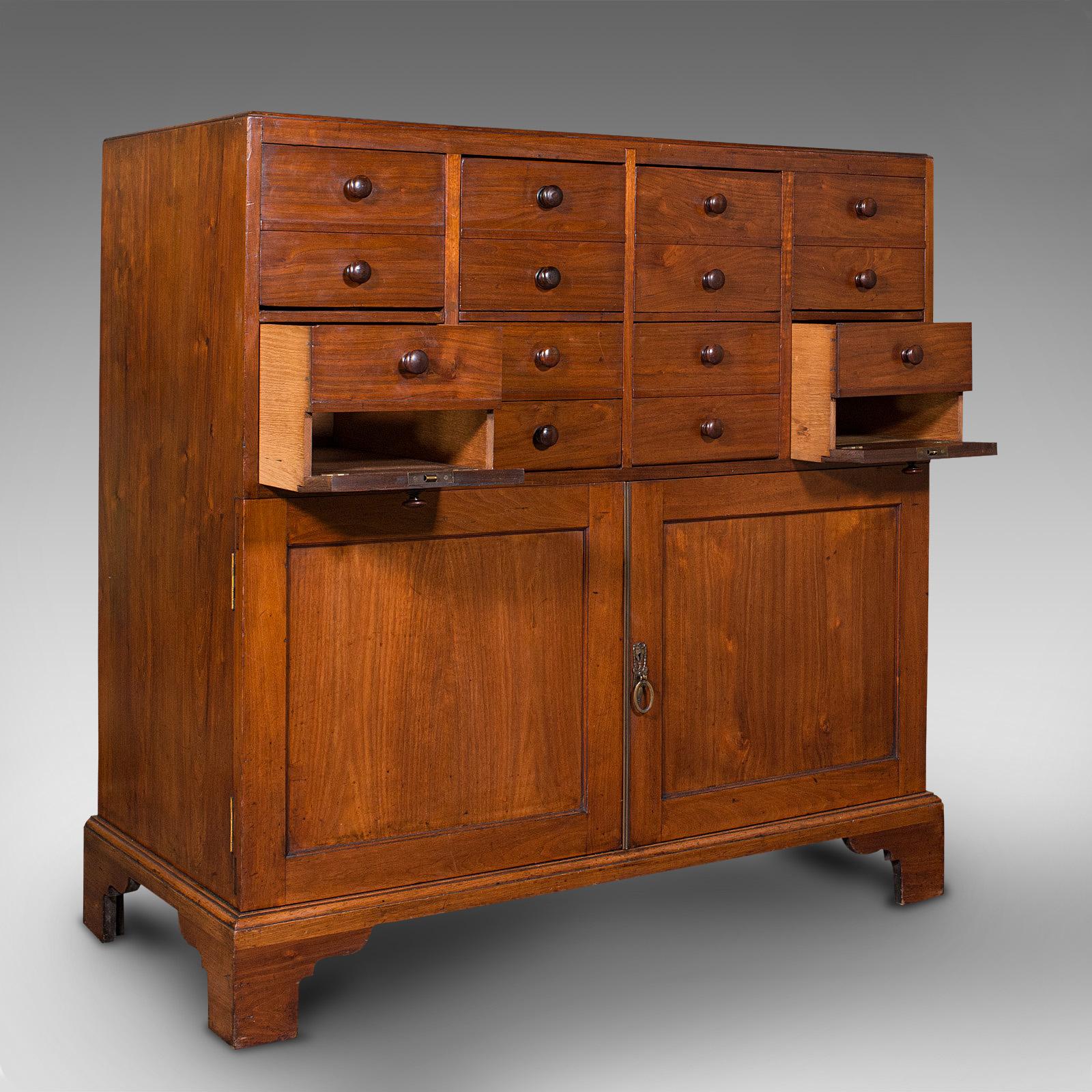 This is a large antique butler's cabinet. An English, walnut and oak estate chest of drawers, dating to the early Victorian period, circa 1850.

Fascinating drop front cabinet of fine quality
Displaying a desirable aged patina throughout
Select