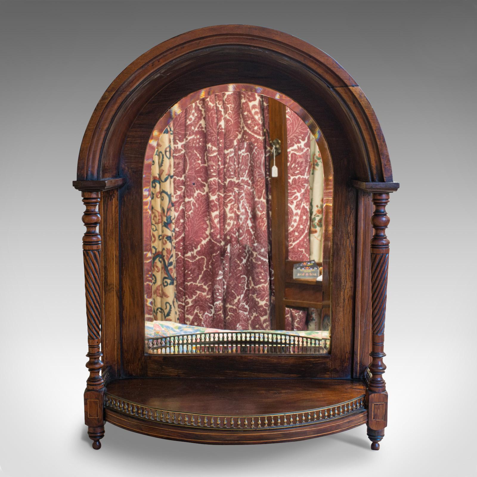 This is an antique butler's mirror. An English, Rosewood dome top wall mirror, dating to the Victorian period, circa 1880.

Elegant mirror with attractive dome top
Displays a desirable aged patina
Select rosewood shows fine grain interest and