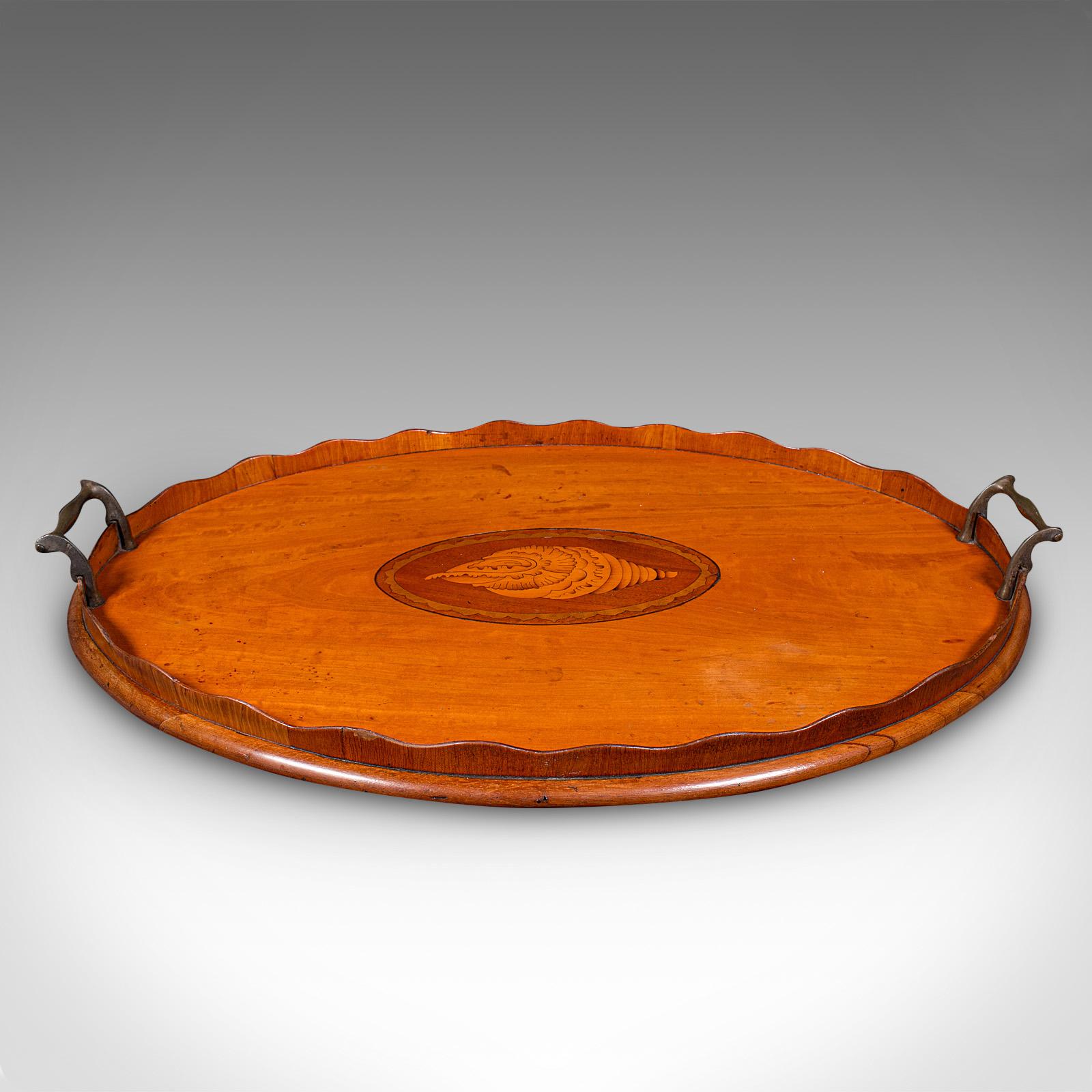 
This is an antique butler's serving tray. An English, satinwood and boxwood afternoon tea platter, dating to the Regency period, circa 1820.

Attractive tray for serving guests, graced with Regency period elegance
Displays a desirable aged patina