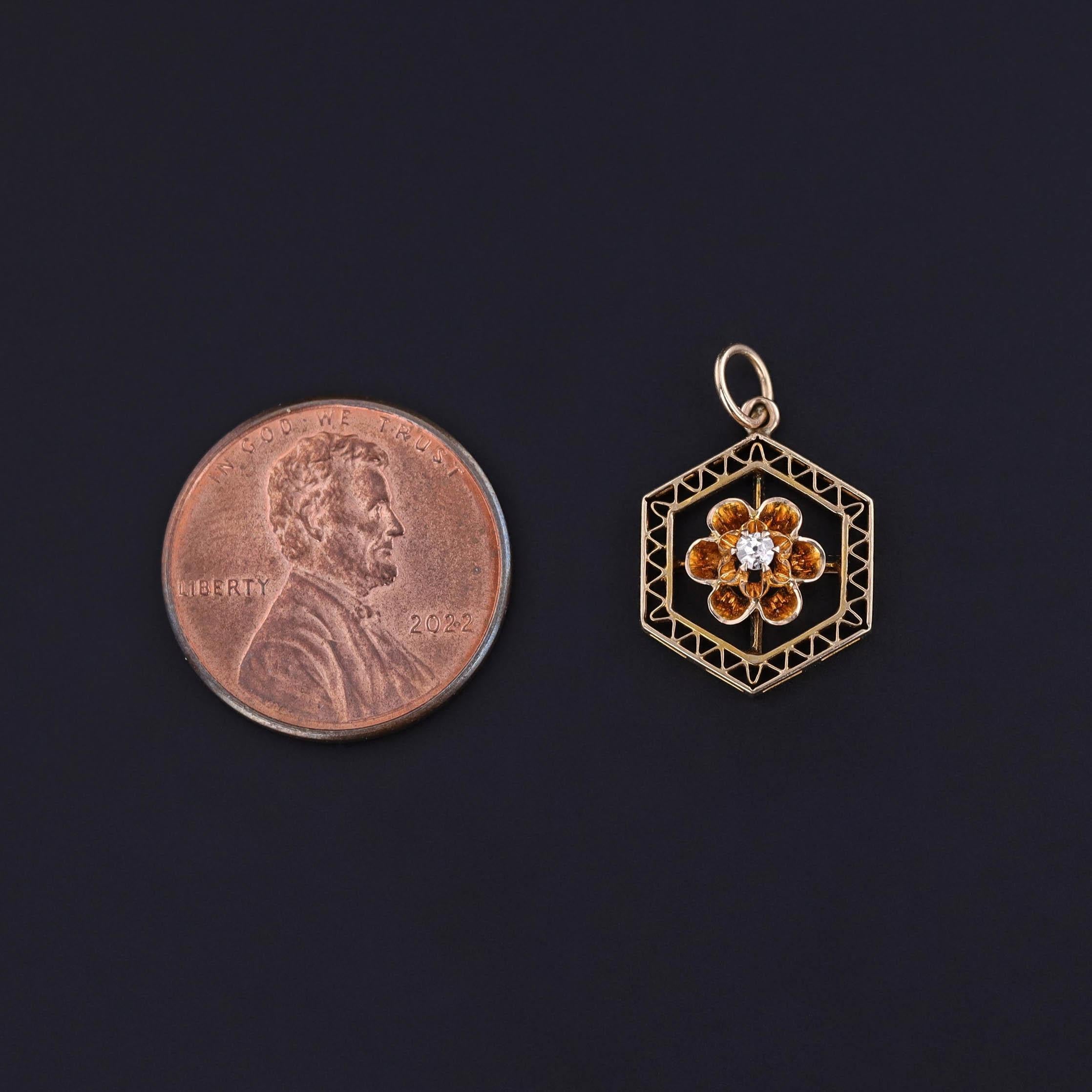 Antique 10k Gold Hexagon Charm with Diamond Accent (Circa 1900)

Delicate and distinctive, this antique charm from around 1900 features an open hexagon crafted in fine 10k gold wire work. At its center, a sparkling diamond sits in a classic