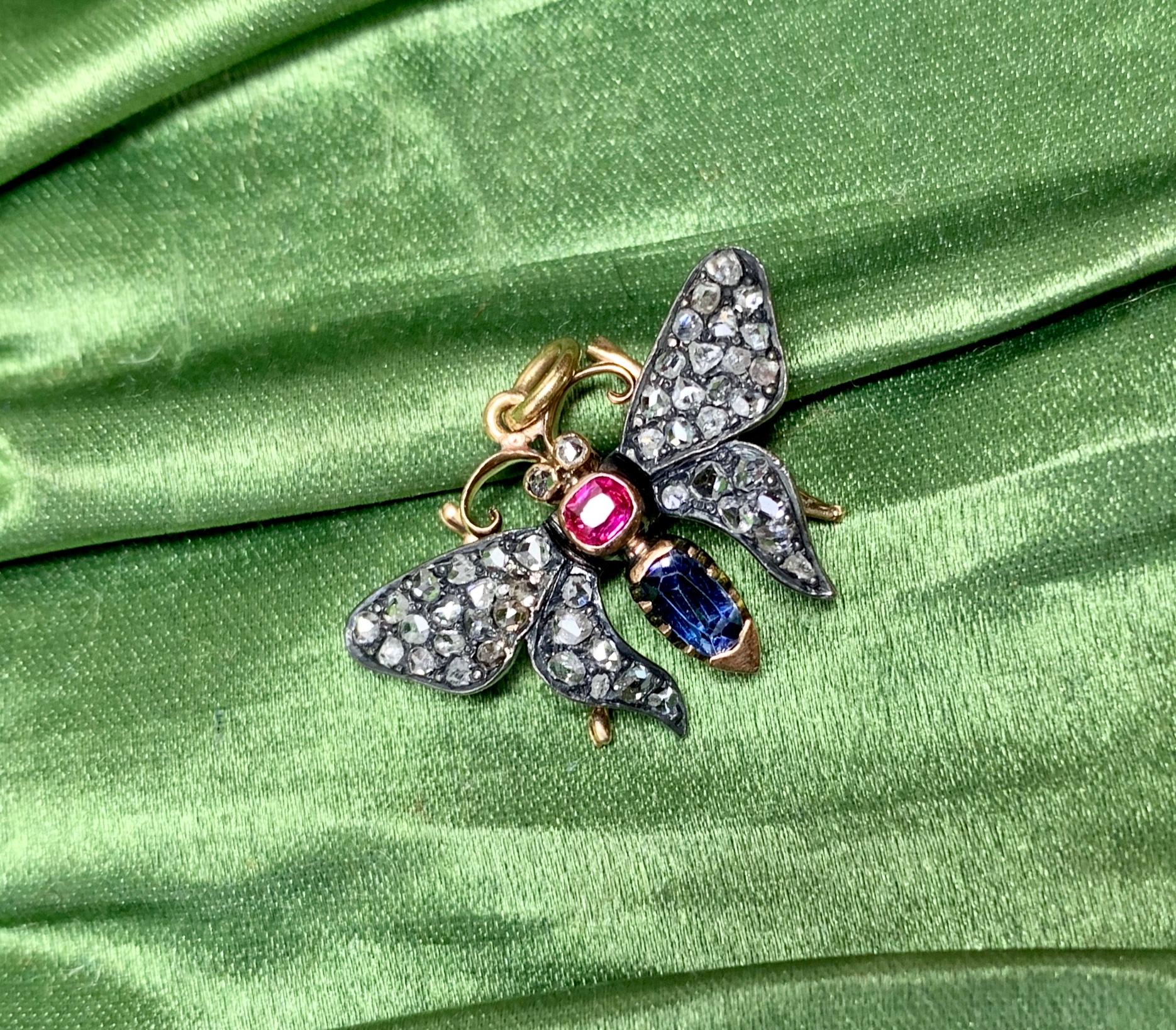 This is a wonderful antique Victorian - Belle Epoque Butterfly Pendant set with Sapphire, Ruby and Rose Cut Diamonds in a gorgeous design in yellow and white Gold.  One of the most beautiful Butterfly Insect Pendants we have seen.  The delicate