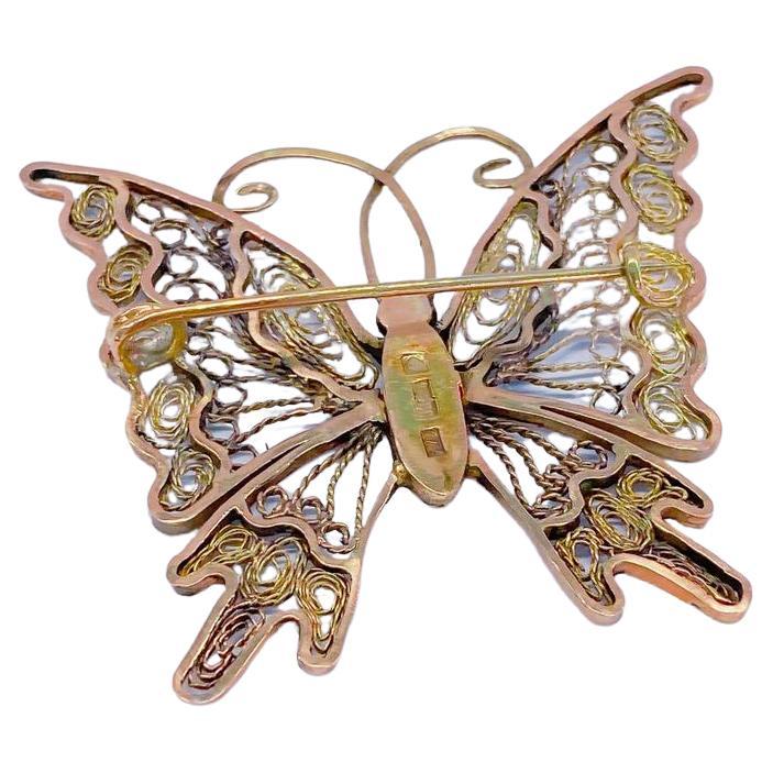 Antike große russische Gold Schmetterling Brosche in Draht offene Arbeit Stil Gelbgold Farbe zentriert mit 2 rosa geschliffenen Diamanten Augen mit einer Höhe von 5 cm und 4 cm Breite und insgesamt 14k Gold Gewicht 13 Gramm Halle markiert 56