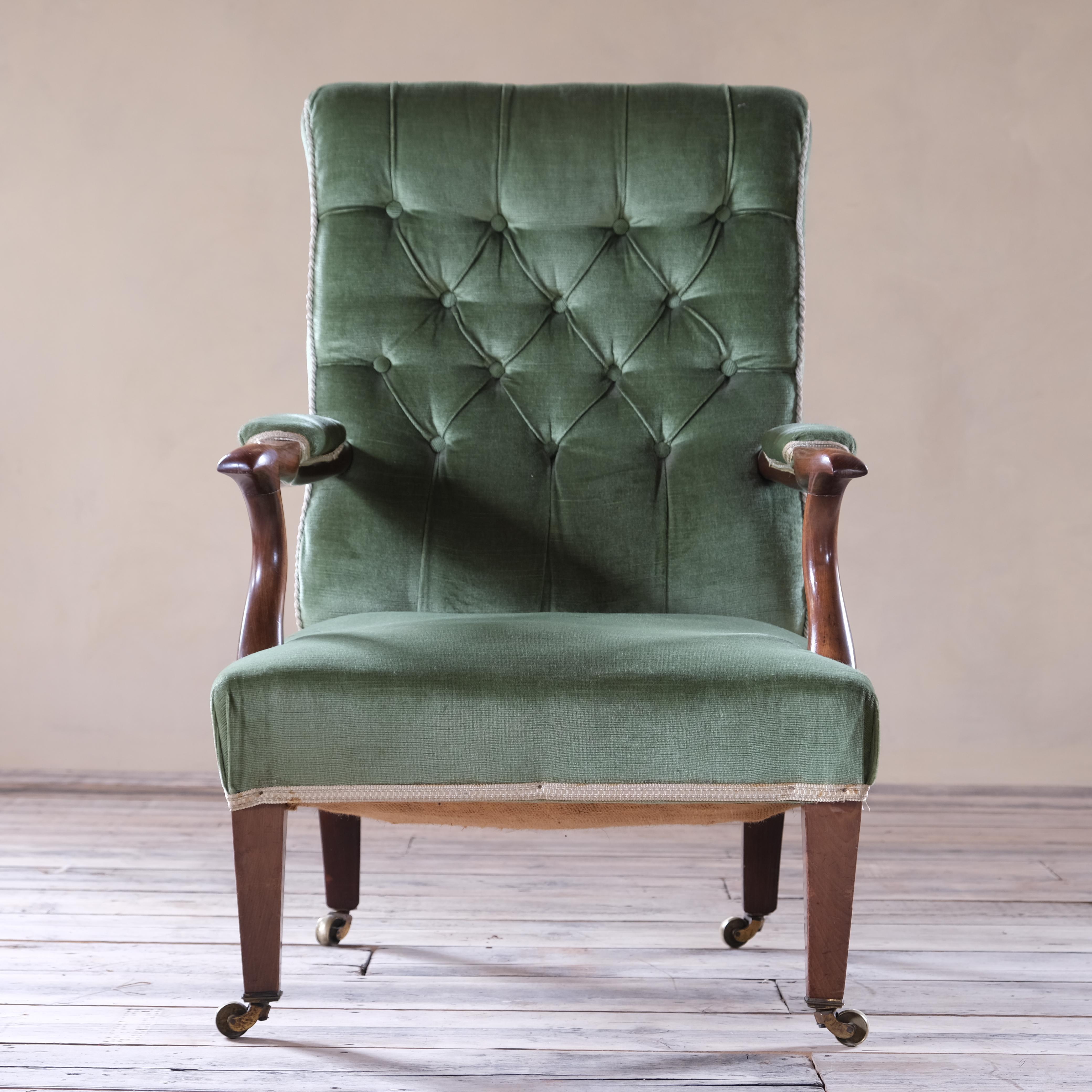 A good quality elegant mahogany open armchair raised square tapered legs and retaining its original brass casters. Upholstered in green velvet which is in good order. 

Structurally sound. 

If you would like this upholstered in your choice of