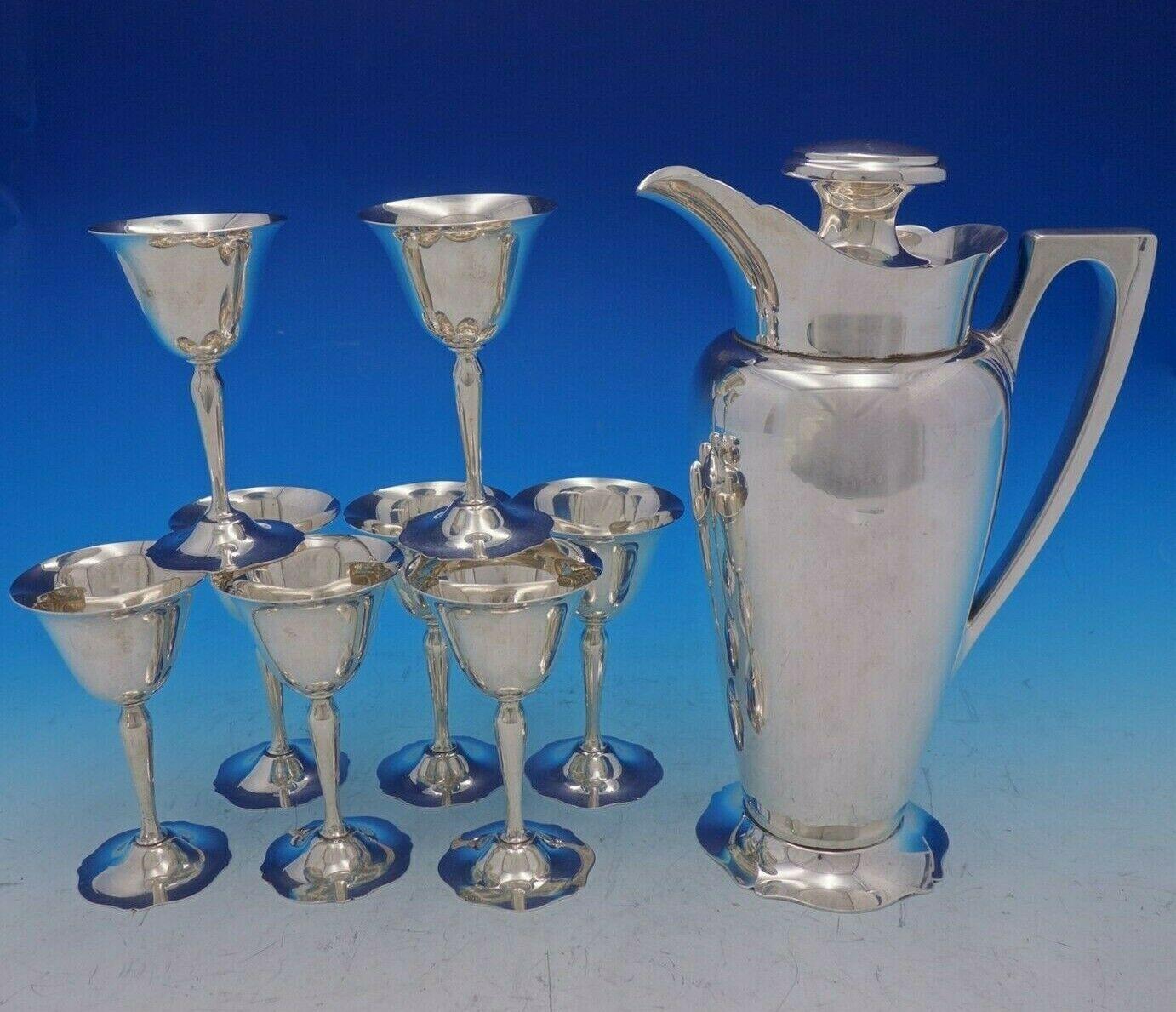 Wallace

Antique by Wallace sterling silver nine-piece martini set. The pitcher/shaker measures 11 1/2