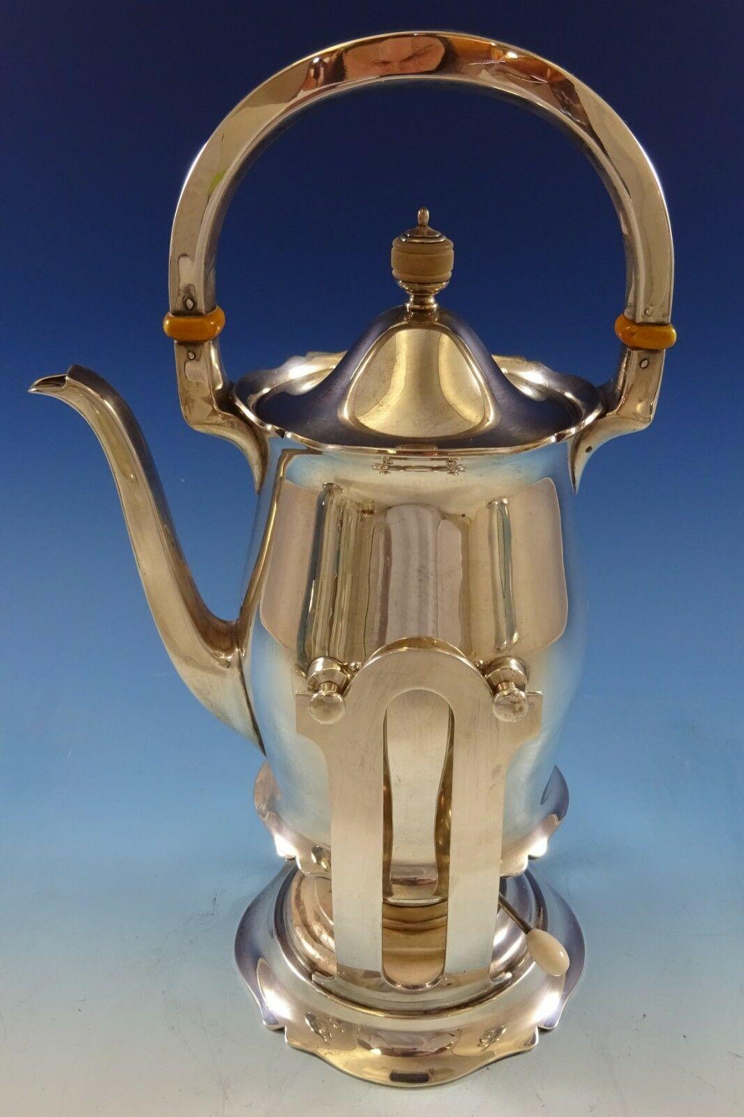 Antique by Wallace
Stunning Antique by Wallace sterling silver 6-piece tea set marked #3370. The set includes:
1 - Kettle on stand: Measures 8 1/2 x 13 3/4 and weighs 63.2 troy ounces.
1 - Coffee pot: Measures 8 1/2 x 9 1/2 and weighs 29 troy
