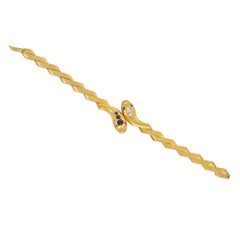 Antique bypass gold and gemset snake bracelet