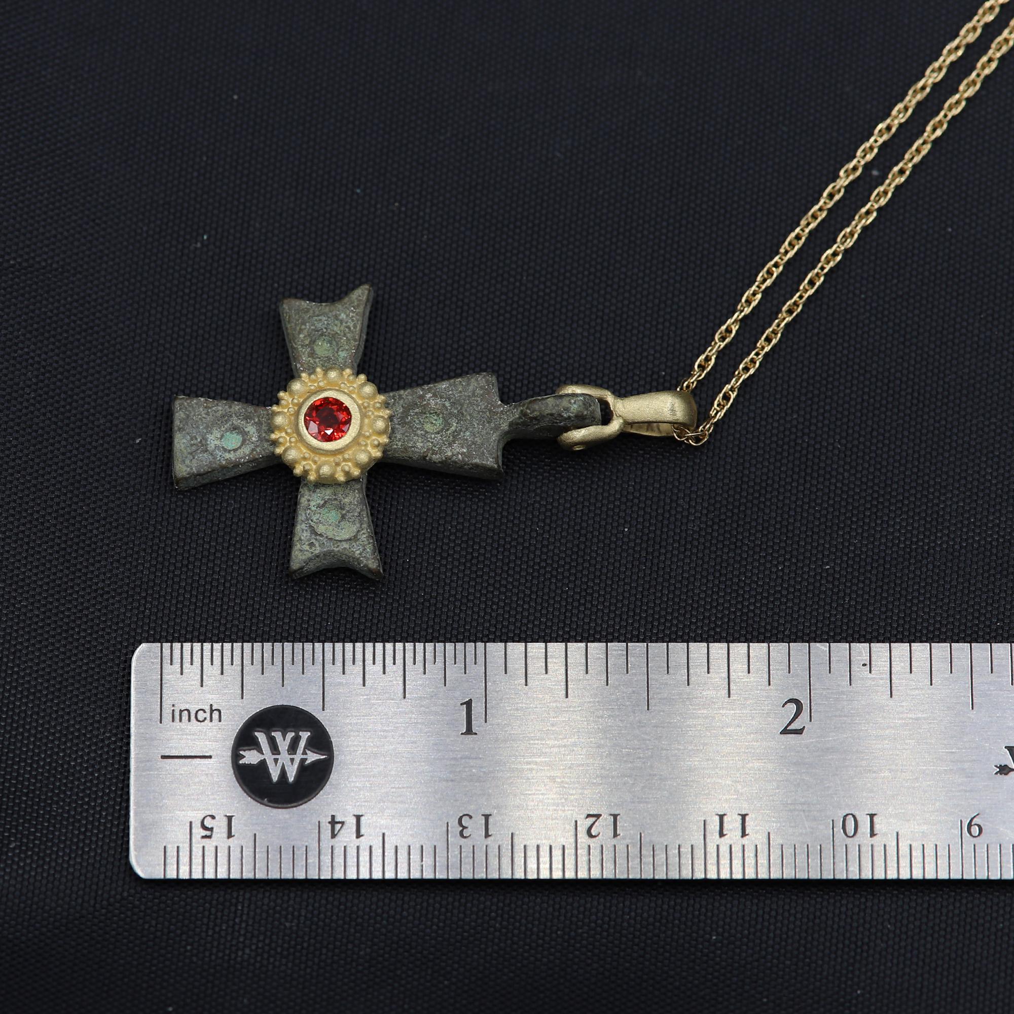 Magnificent piece of History - can be yours today !
Ancient Byzantine Period cross.
Hand set in Italy with 18k Yellow Gold & Red Sapphire.
Approx size 1' inch / 25 mm.
This Antique Bronze Cross is estimated from 600-900 AD 
Chain Not Included  
Rich