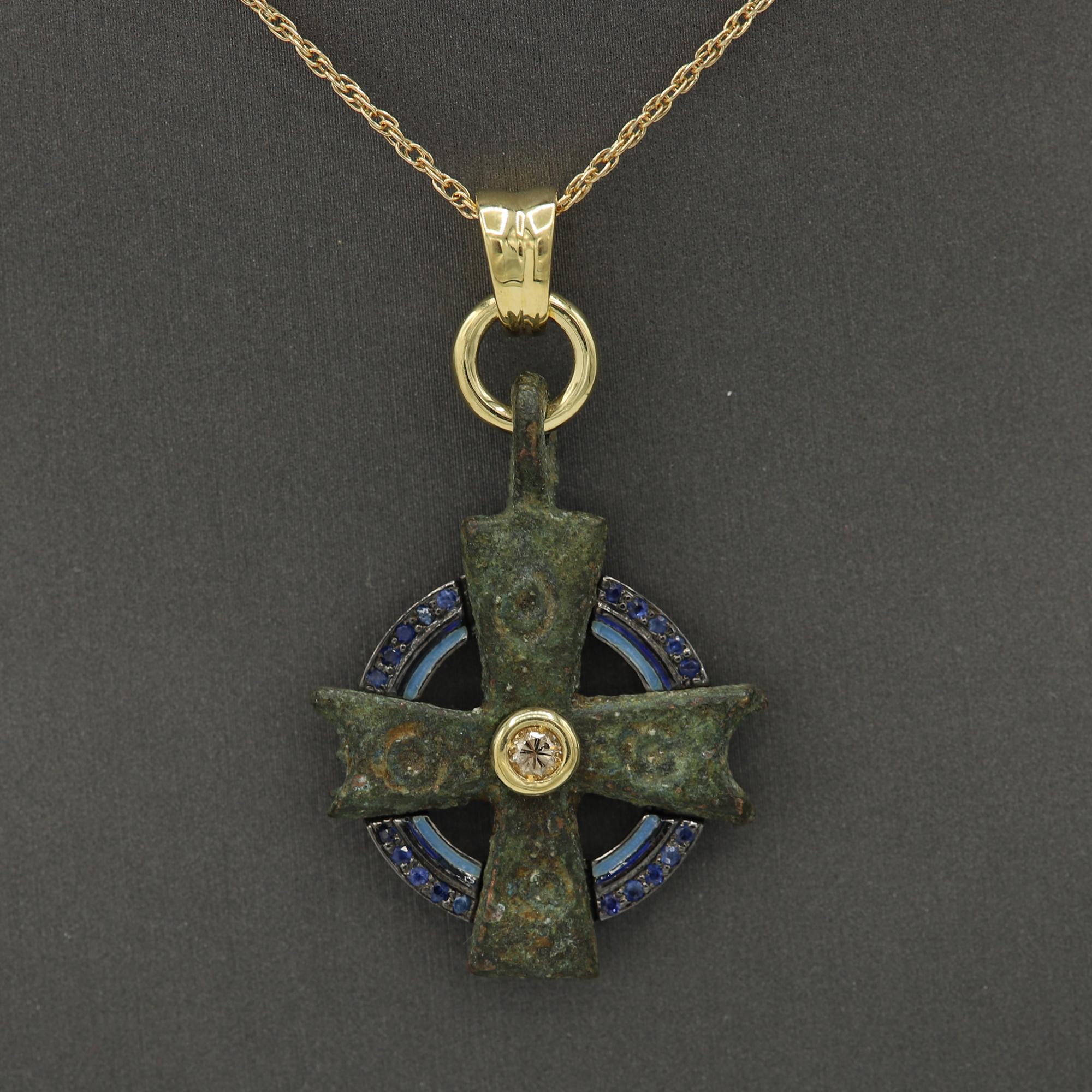 Magnificent piece of History - can be yours today !
Ancient Byzantine Period cross.
Hand set with 18k Yellow Gold and Sterling silver on the back side.
Hand Made in Spain. 
Approx size 1.5' inch or 30 mm.
With a center Diamond and Blue Sapphire gems
