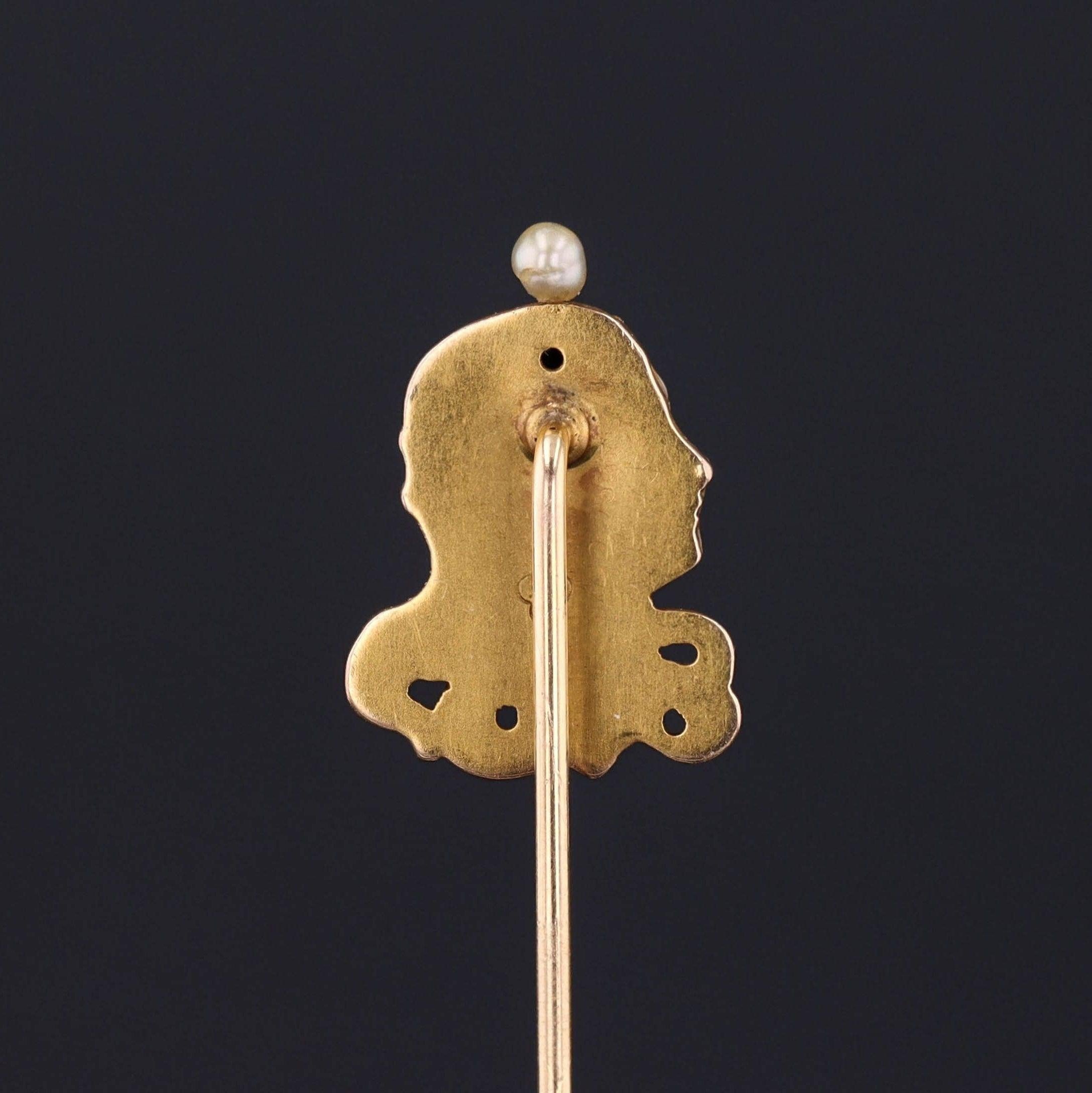 During the turn of the nineteenth century, artisans were inspired by the changing roles of women in society and began depicting the free flowing feminine form in brooches, bracelets, rings and more.

This antique 14k gold stickpin (circa 1910)