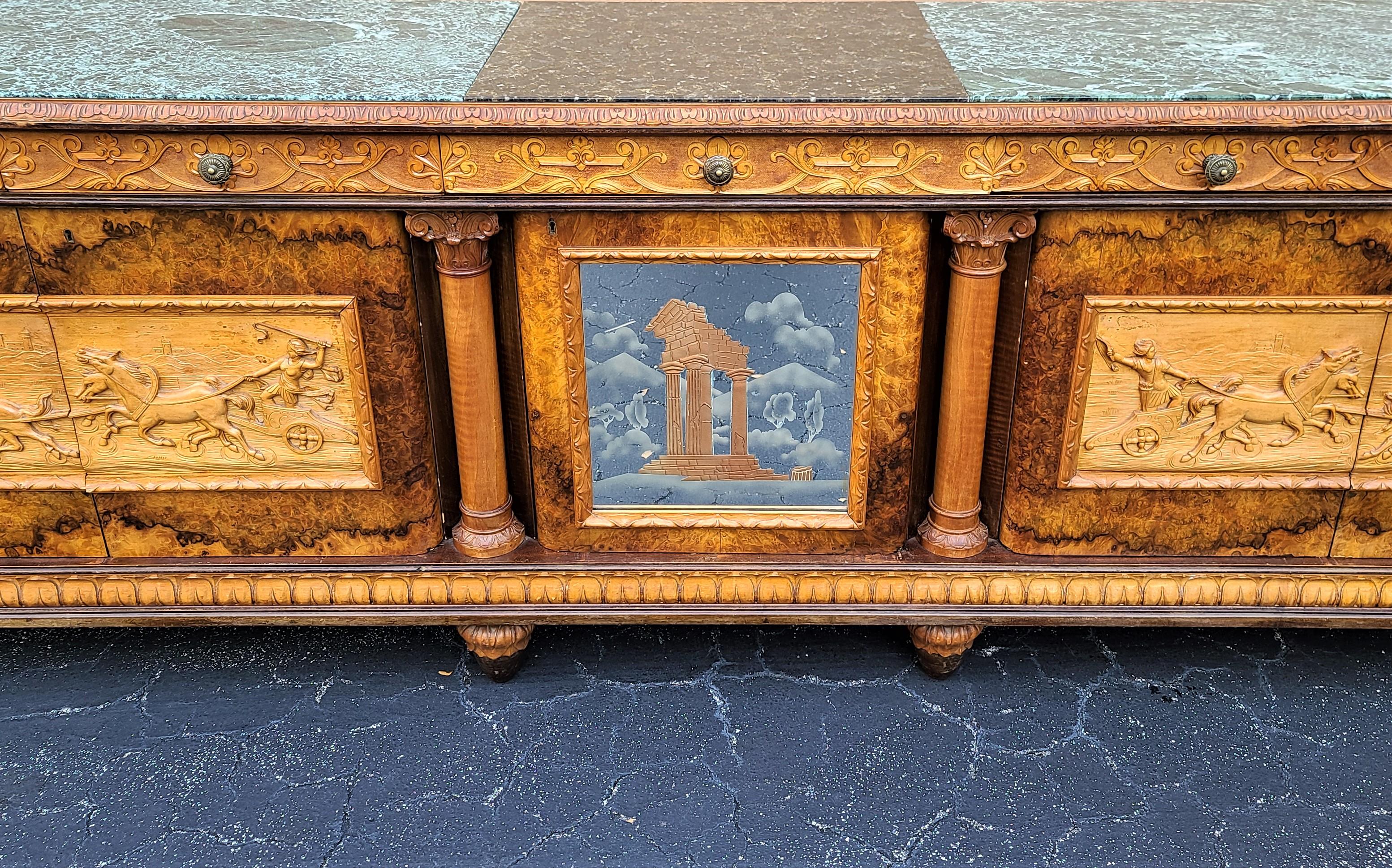 offering one of our recent Palm Beach estate fine furniture acquisitions of an
antique c 1900 hand carved Neoclassical Italian credenza bar cabinet

Featuring all hand-carved drawer and door fronts surrounded by burl wood veneer, marble and stone