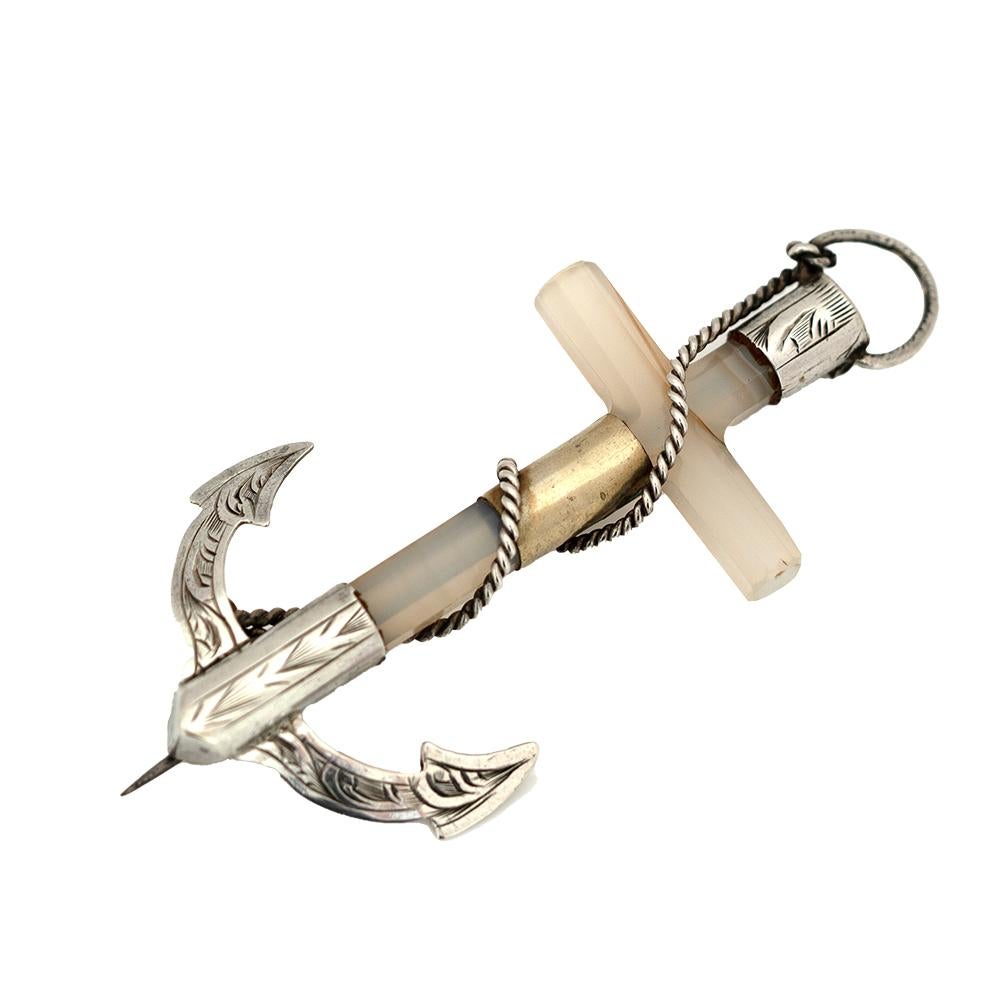 This symbolic Victorian brooch takes the form of an anchor entwined with a cross — a meaningful representation of faith, hope, and charity, a trio of virtues popular in 19th-century sentimental jewellery.

Expertly crafted in agate, engraved silver,