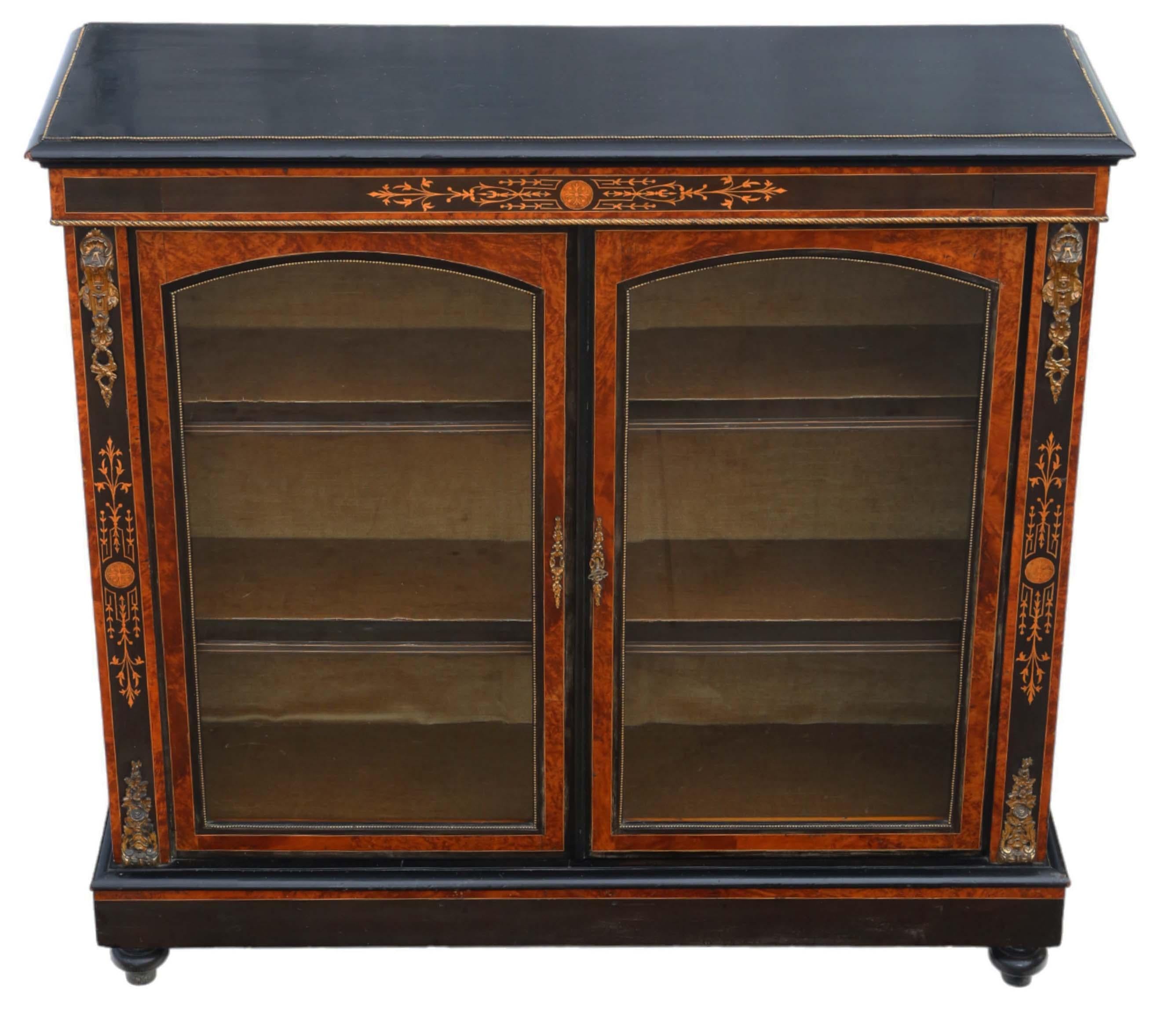 Antique, circa 1880, large quality inlaid ebonised, amboyna and burr walnut pier display cabinet in Aesthetic style. It showcases the best color and patina.

Solid and sturdy, with no loose joints and a key included. The cabinet features lovely