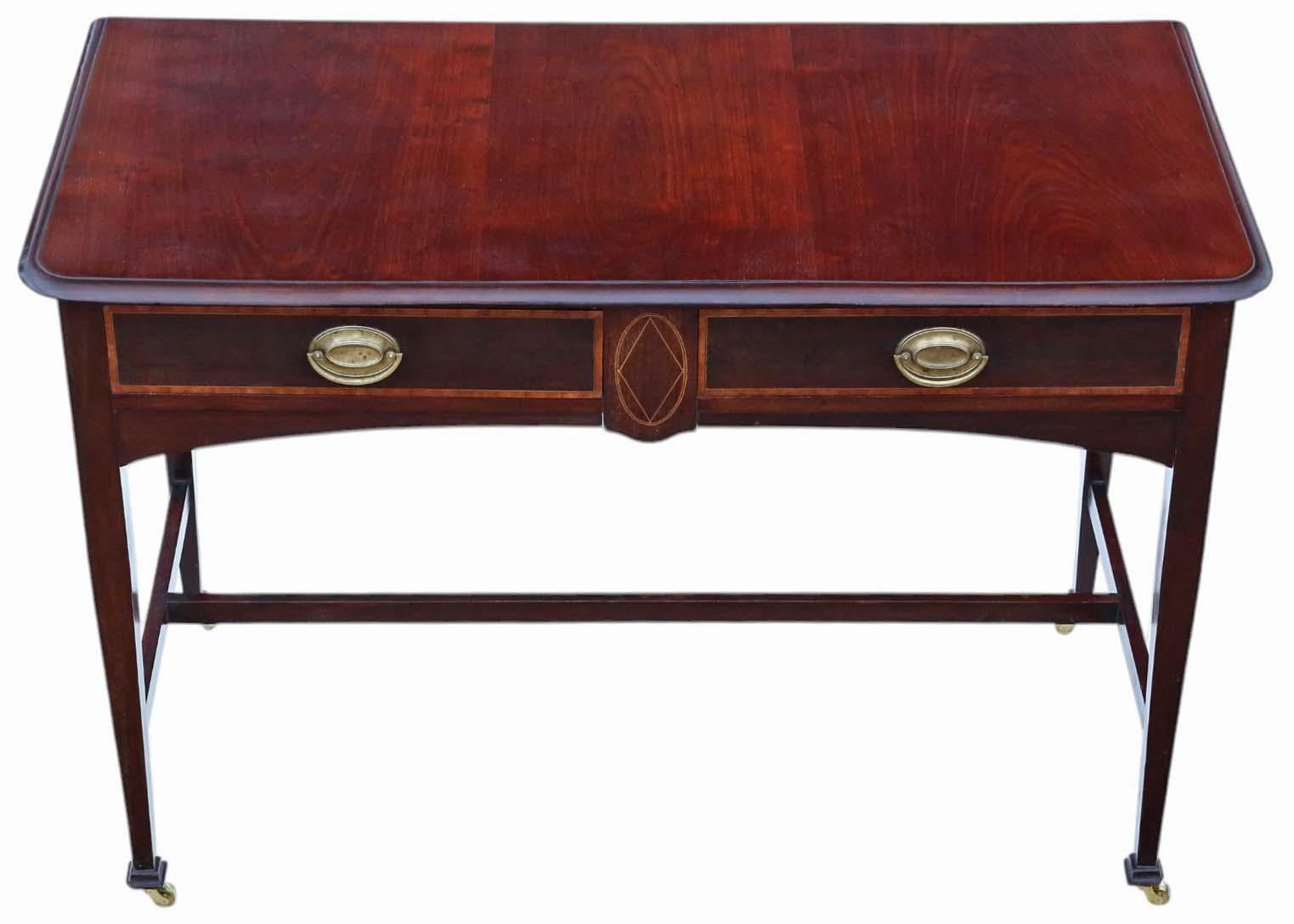 Antike c.1900 Feine Qualität Intarsien Mahagoni Schreiben / Dressing Tisch - Ideal auch als Schreibtisch oder Beistelltisch

Dieser elegante antike Tisch aus der Zeit um 1900 zeichnet sich durch klare Linien und ein schlichtes, aber raffiniertes