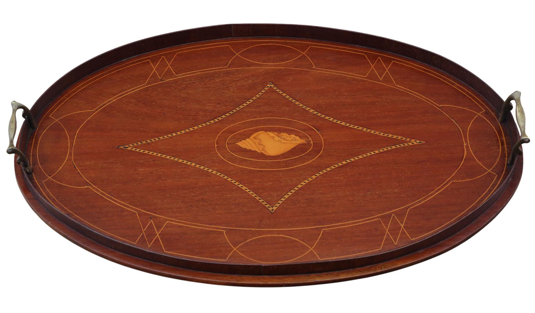 Ancien plateau de service en acajou marqueté A.I.C. C.C. - Belle qualité

Un plateau de service en acajou du début du 20e siècle avec une patine d'âge, de couleur et d'aspect attrayante. Cette rare trouvaille décorative est pleine de charme et de