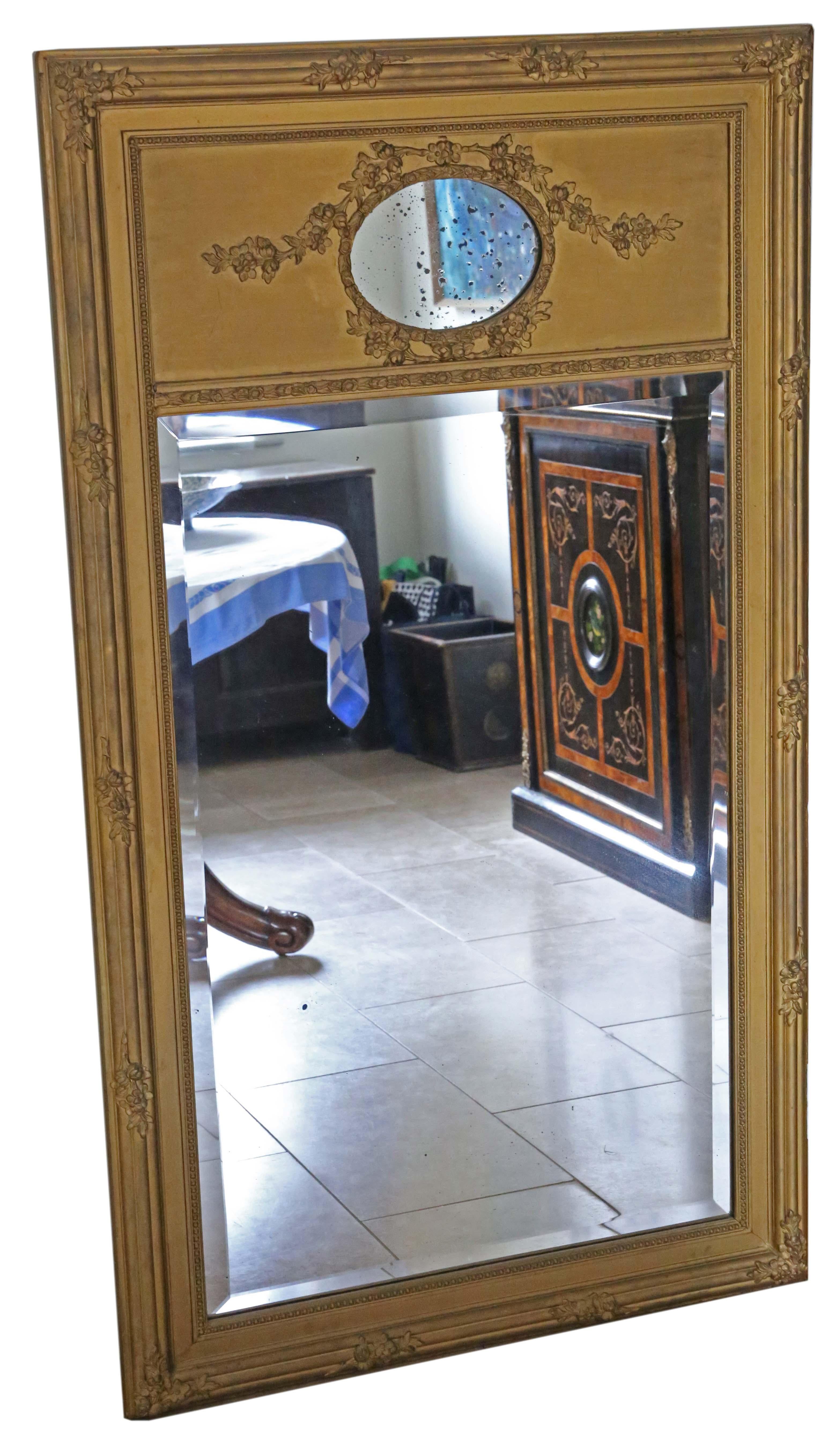 Antique circa 1900 large quality gilt floor wall overmantle trumeau mirror.

No loose joints or woodworm.

The main original bevel edge mirrored glass has light oxidation, some shadowing and age related imperfections.

The oval original