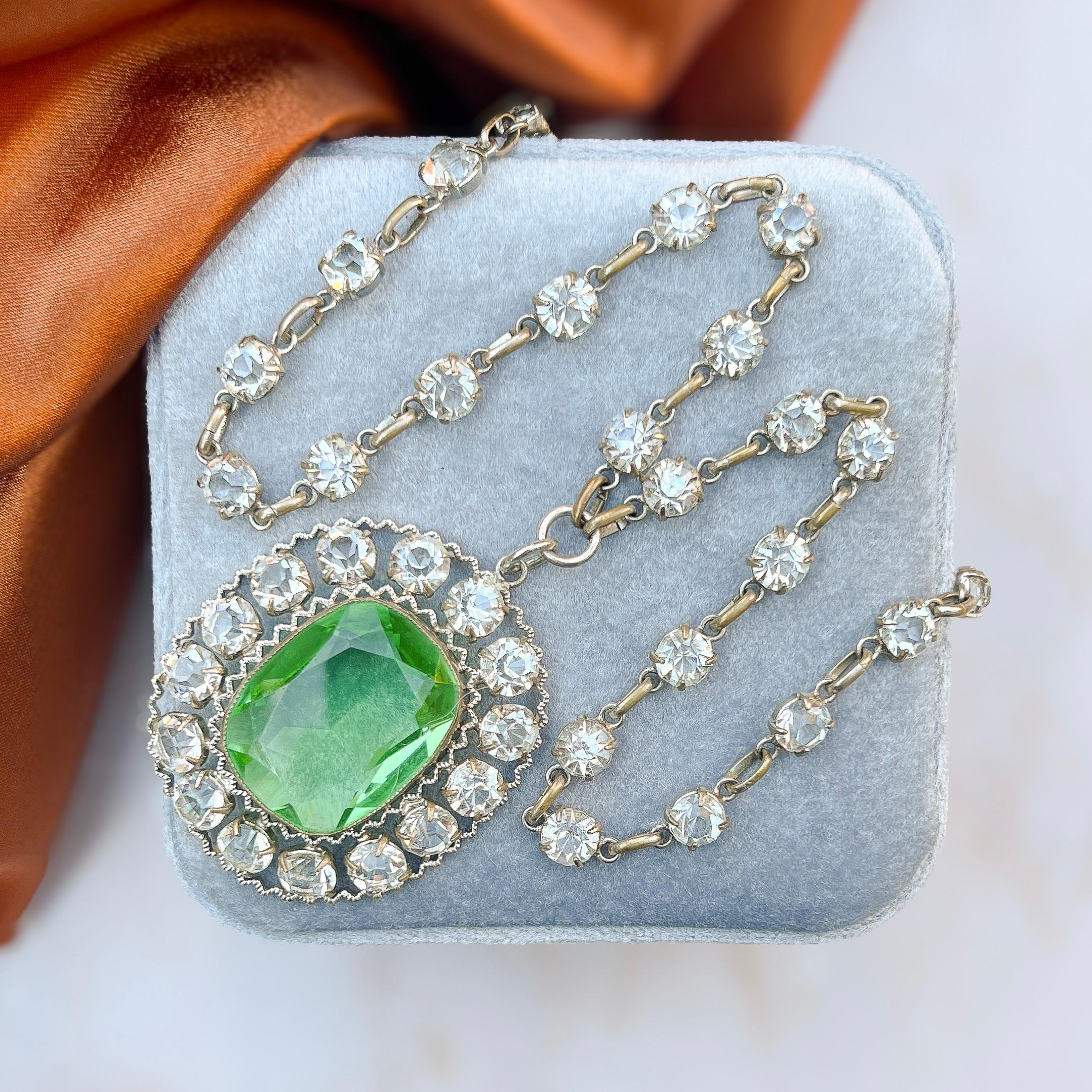 This elegant necklace was created in c.1910. 

Condition Report:
Very Good - Some wear to the plating on some of the links of the necklace. This is consistent with age and does not detract from the appeal of the piece. 

The Details...
This necklace