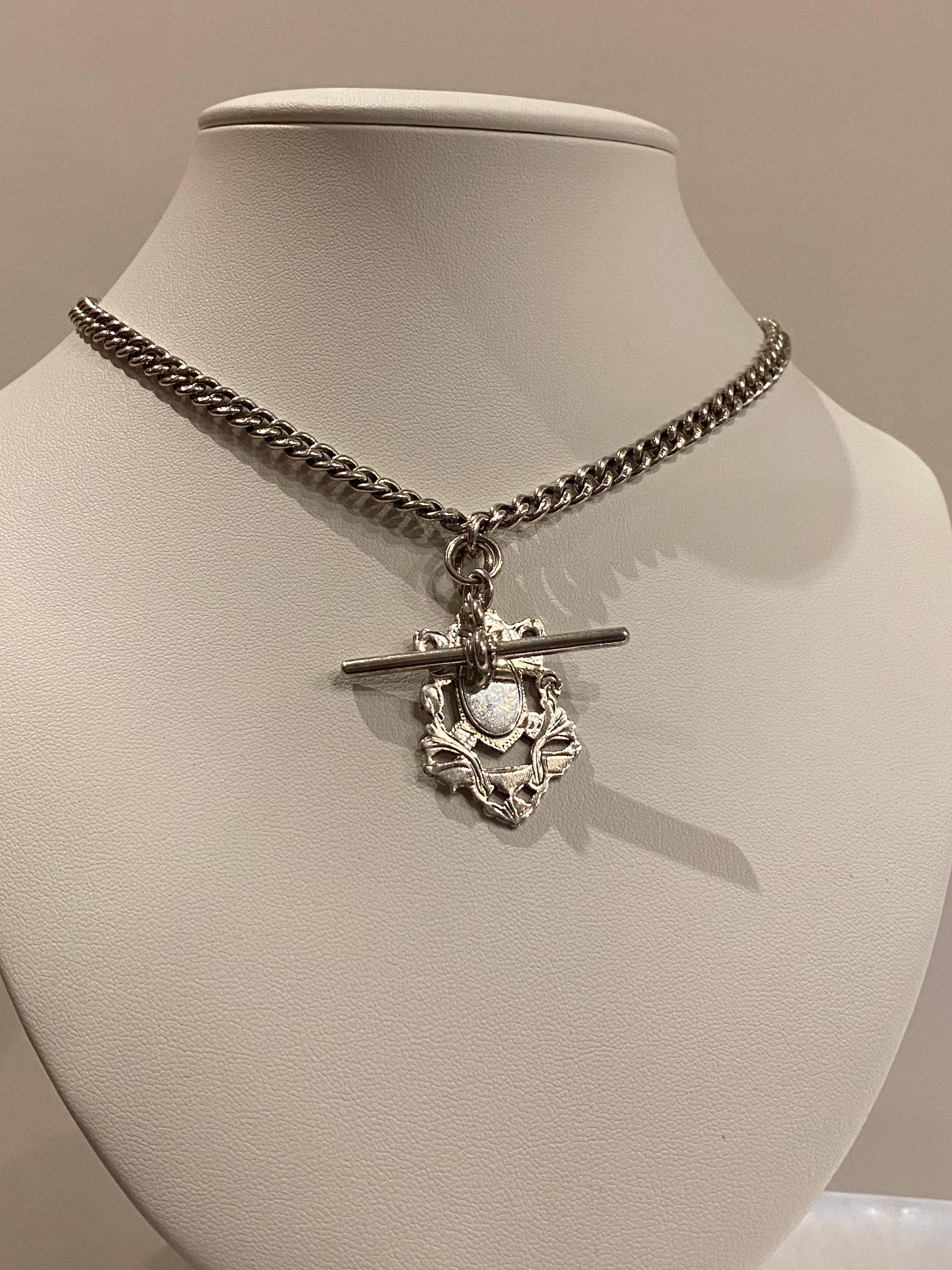 Magnificent English Necklace, 
meticulously crafted in 925 Sterling Silver, 
featuring an intricate shield-shaped pendant - 
39mm x 24mm;
bearing English hallmarks to the back:
Birmingham & letter date - 1910
& T-bar, stamped & hallmarked 

Each