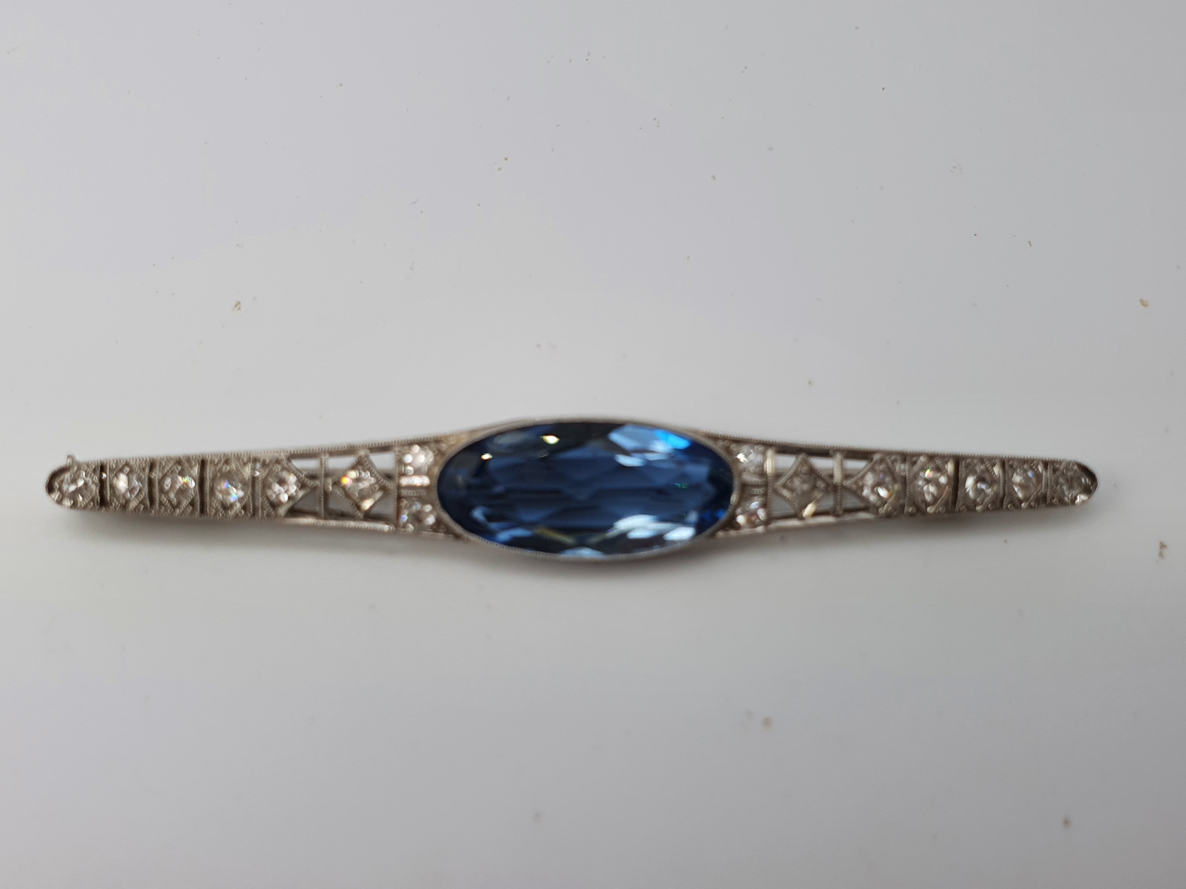 Antique: c(1930) Art Deco Platinum;  Swiss Cut Diamond; Faceted Iolites  Brooch by Gregory & Sheenan:  Rio De Janeiro - Original Box; Magnificent Condition

Gregory & Sheenan were originally part of the Cartier stable and set up independently in the
