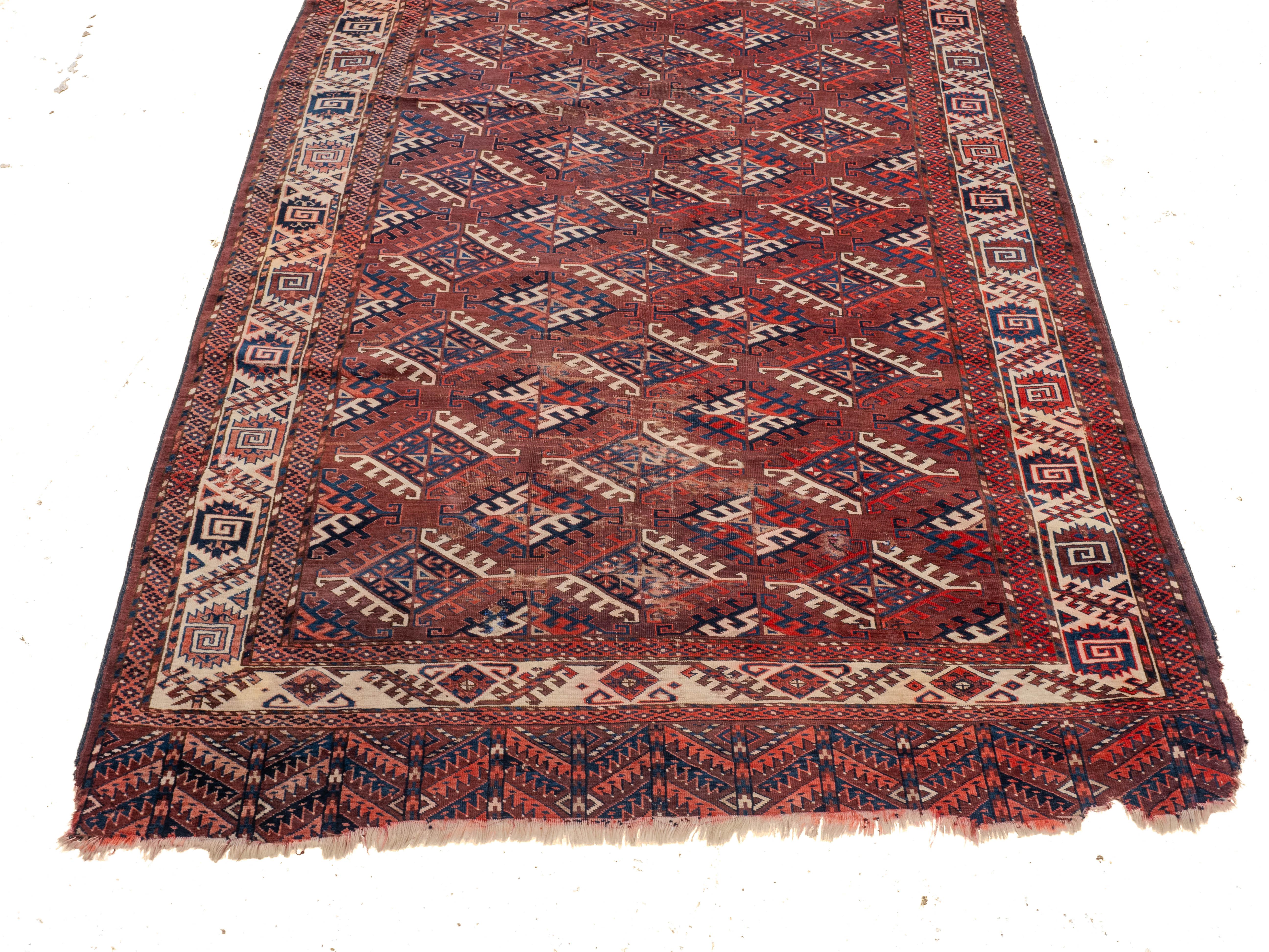 Turkmeno Antico tappeto turkmeno Yomut del XIX secolo Dyrnak Guls (Tappeto orientale tessuto a mano) in vendita