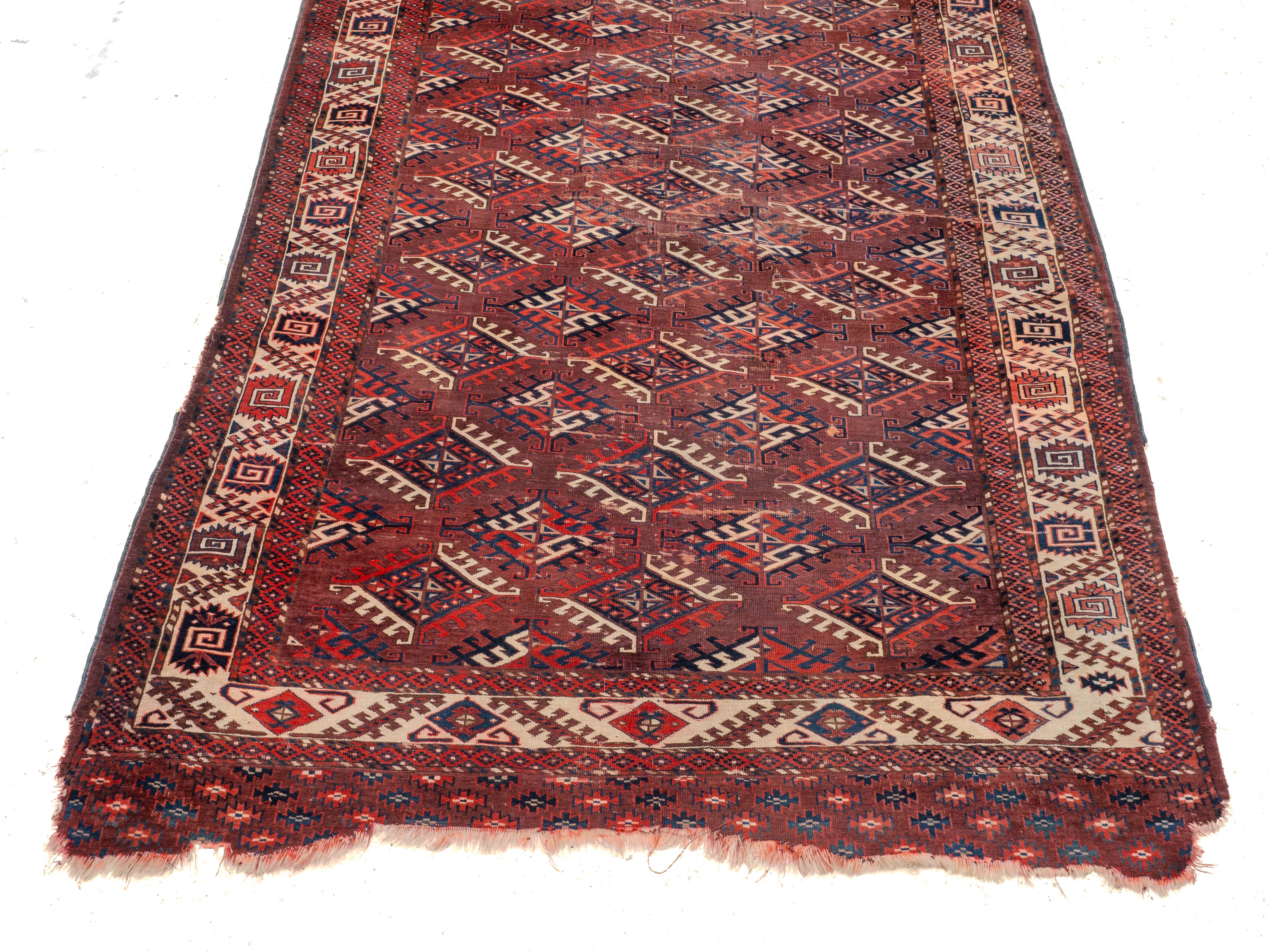 Tessuto a mano Antico tappeto turkmeno Yomut del XIX secolo Dyrnak Guls (Tappeto orientale tessuto a mano) in vendita