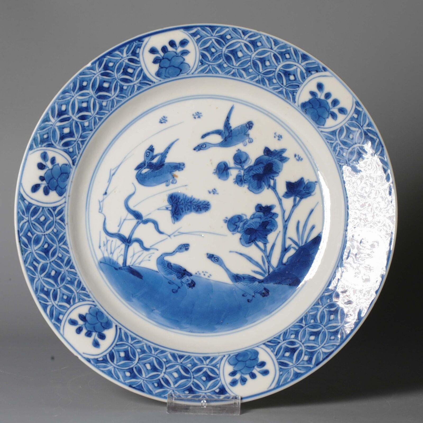 ovely and high quality dish with a beautiful decoration of Ducks or Geese in a floral landscape scene. The border with flowers and ancient coins. Kangxi period.

With a nice mark at the base; Lozenge with ribbons.

28-6-22-1-6


Condition
1 small
