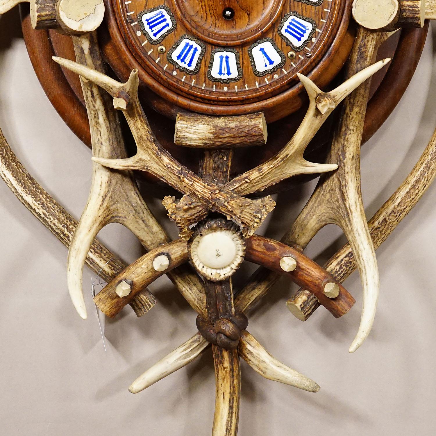 Austrian Antique Cabin Antler Wall Clock with Deer Head Austria ca. 1900 For Sale