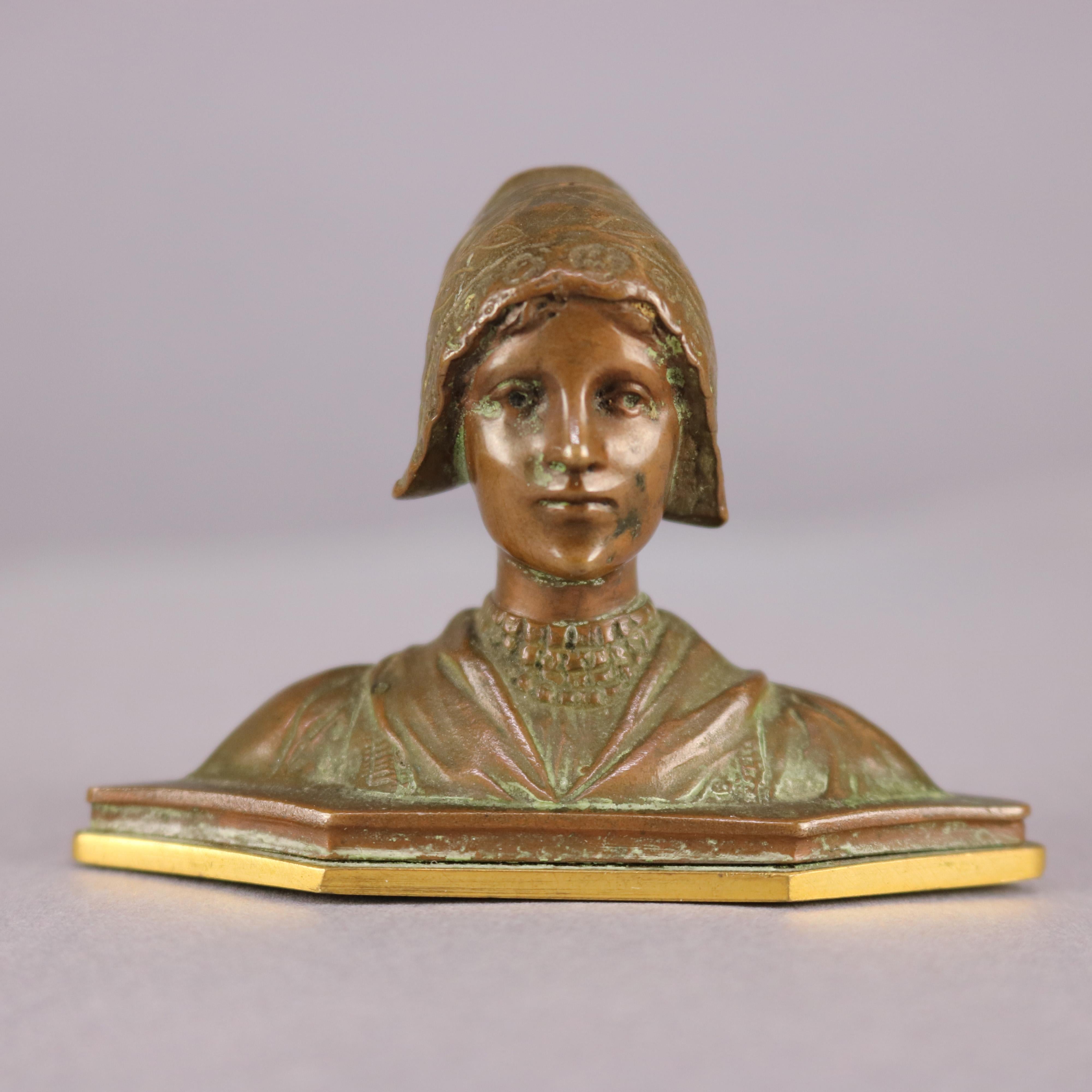 An antique cabinet sculpture offers bronze construction and depicts portrait bust of young woman, circa 1900

Measures: 2.25