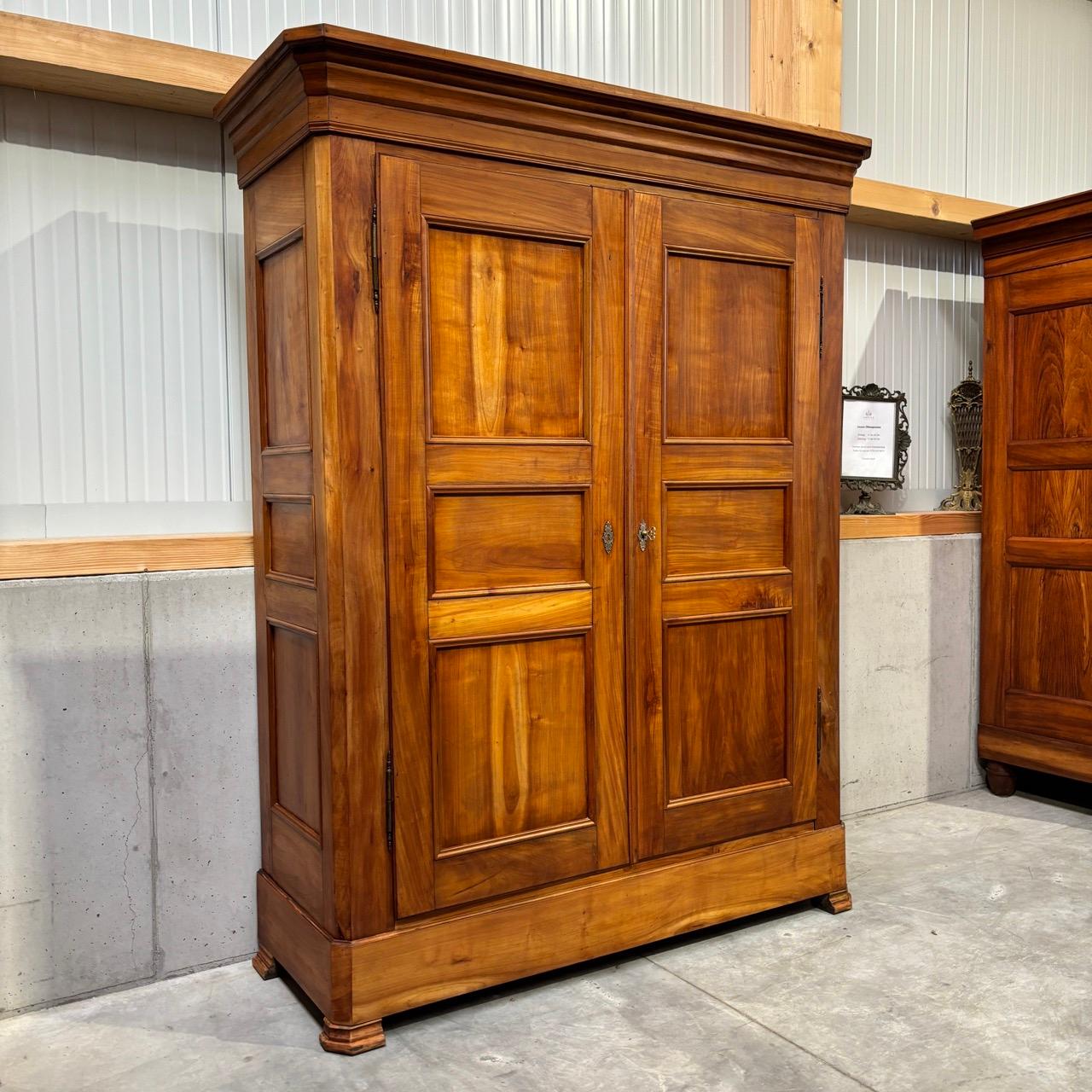 ✓ Restored surface
✓ Classic shapes
✓ Beautiful wood grain
✓ High quality and durable

Dimensions:  W: 164cm H: 211cm D: 63cm

Article: Antique closet  closet  2-door
Item no.: 993
Epoch: France, Louis Philippe around 1850
Material: Cherry wood,