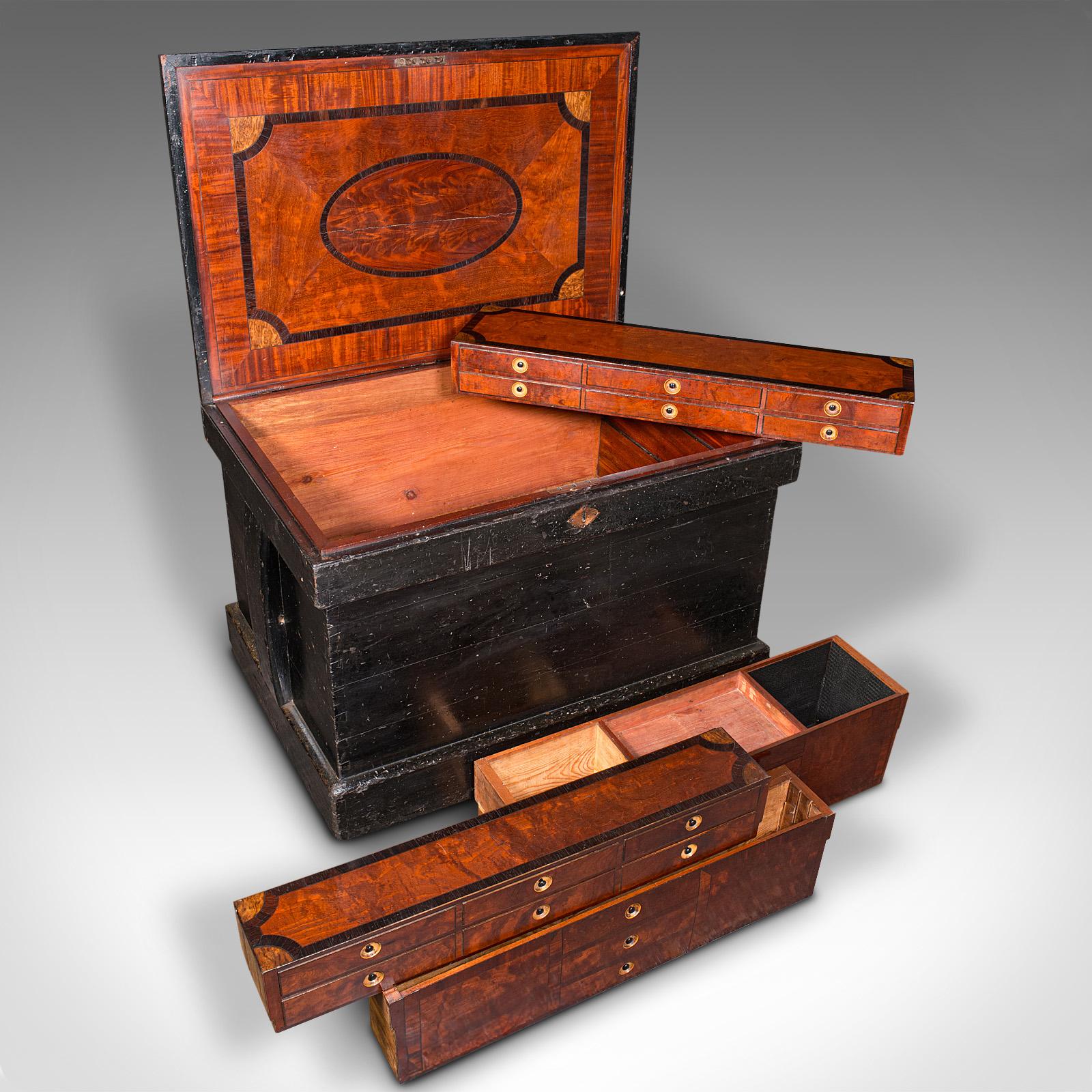 This is an antique master cabinet maker's chest. An English, heavy tool trunk with mahogany and walnut interior, dating to the early Victorian period, circa 1850.

Wonderful master craftsman's tool chest with an exquisite fitted interior
Displays a