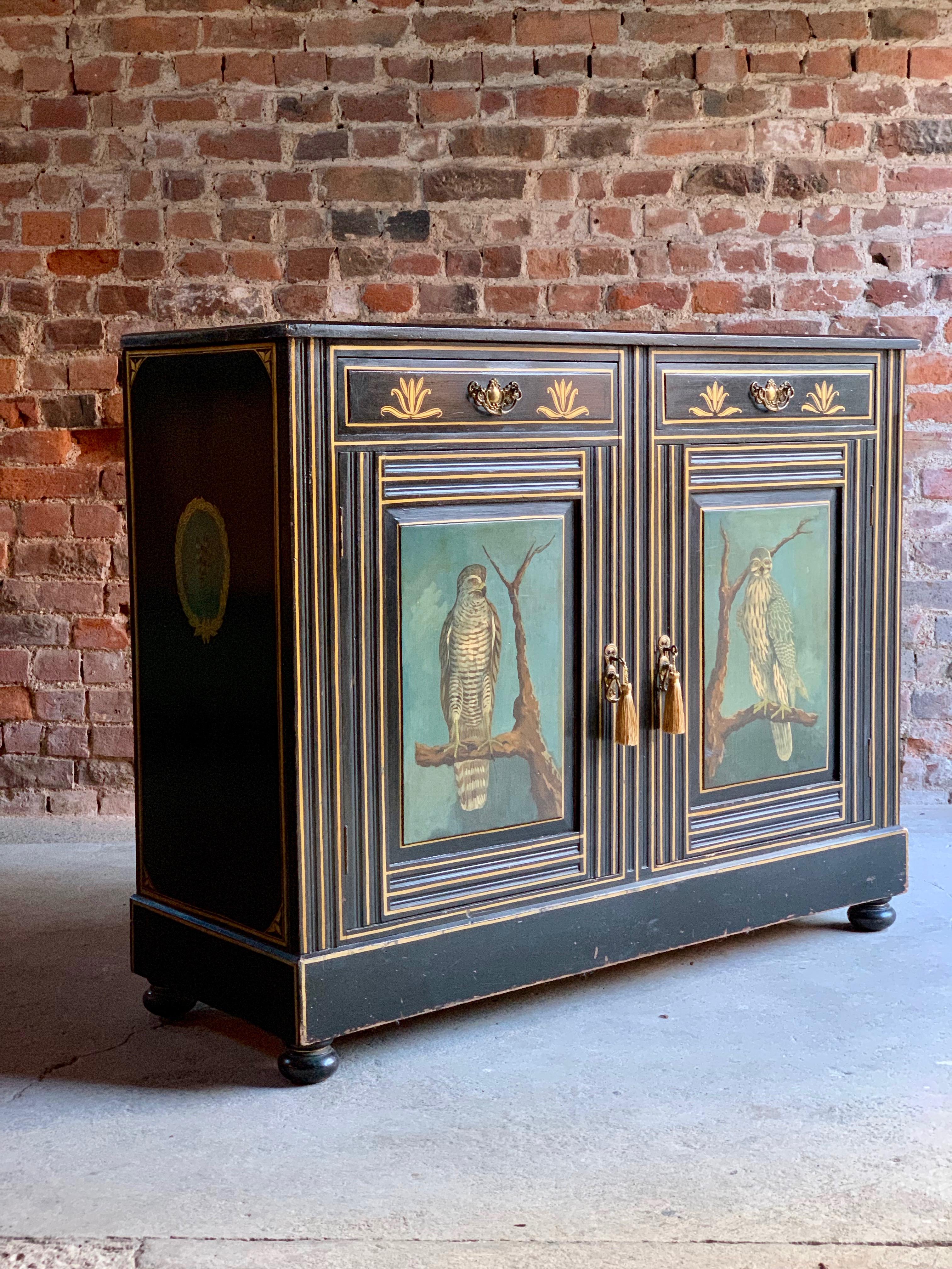 A magnificent Victorian 19th century hand painted side cabinet, circa 1890, overall painted with birds of prey and other fowl, the rectangular top above two frieze drawers and two panelled cupboard doors, raised on bun feet.

Condition report: The