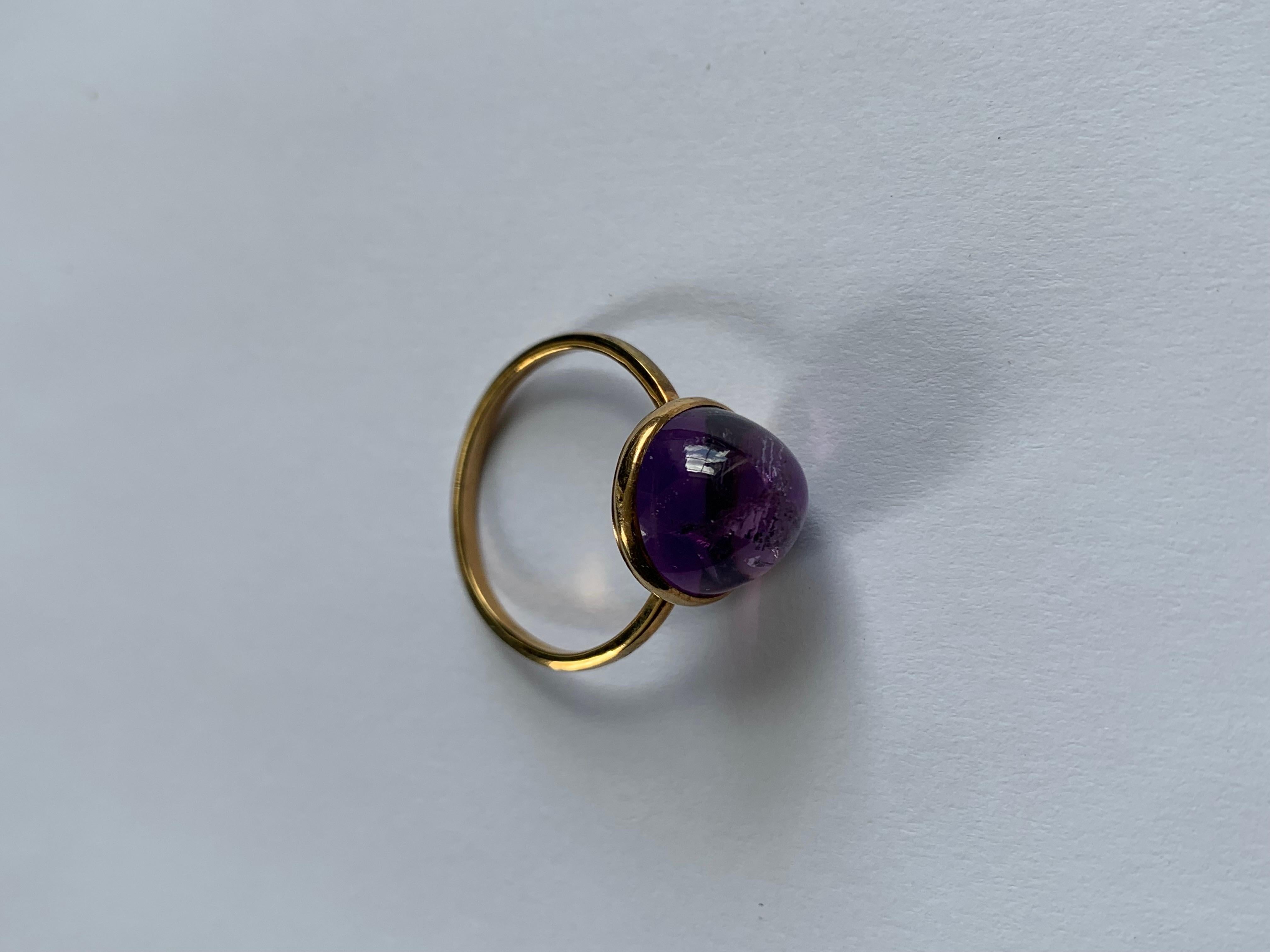 Wonderfully shaped cabochon amethyst cocktail ring. 
-Weight: 2.73g
-Measurements: Size UK R, Face 12x12mm, Height off finger 8.7mm
-Materials: 9ct yellow gold
-Hallmarks: none present 
-Condition: Good Overall - please refer to the photos provided