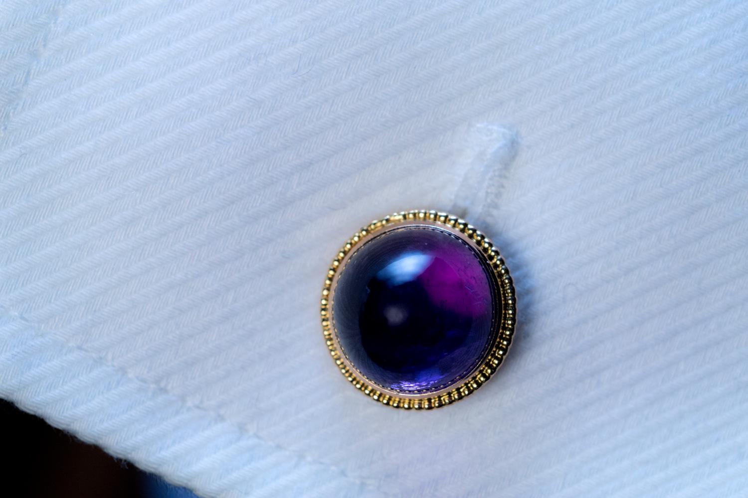 These 14K gold mounted cabochon cut amethyst cufflinks were made in Vienna, Austro-Hungarian Empire, in the 1890s-early 1900s.

The amethysts are likely of Siberian origin.

The cufflinks are marked with a fox head assay mark for the 4th gold
