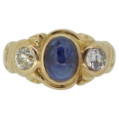 Antique Cabochon Sapphire and Diamond Three-Stone Ring