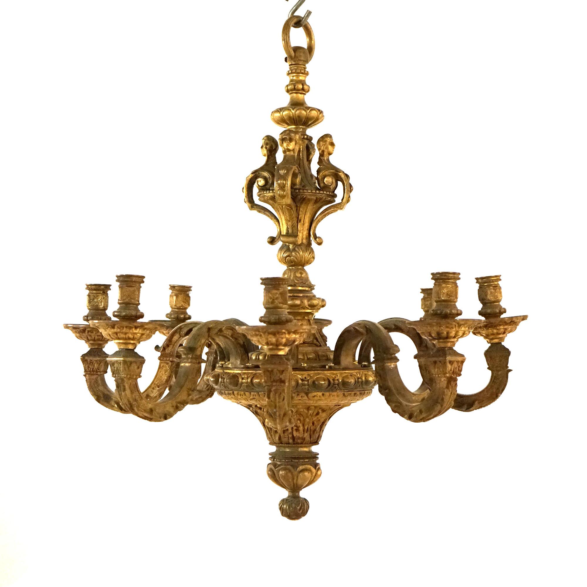 An antique Caldwell French Louis XIV figural candelabra chandelier offers cast metal construction with upper having female caryatids over foliate embossed base with eight scroll form arms terminating in candle sockets, 19thC

Measures - 29.5