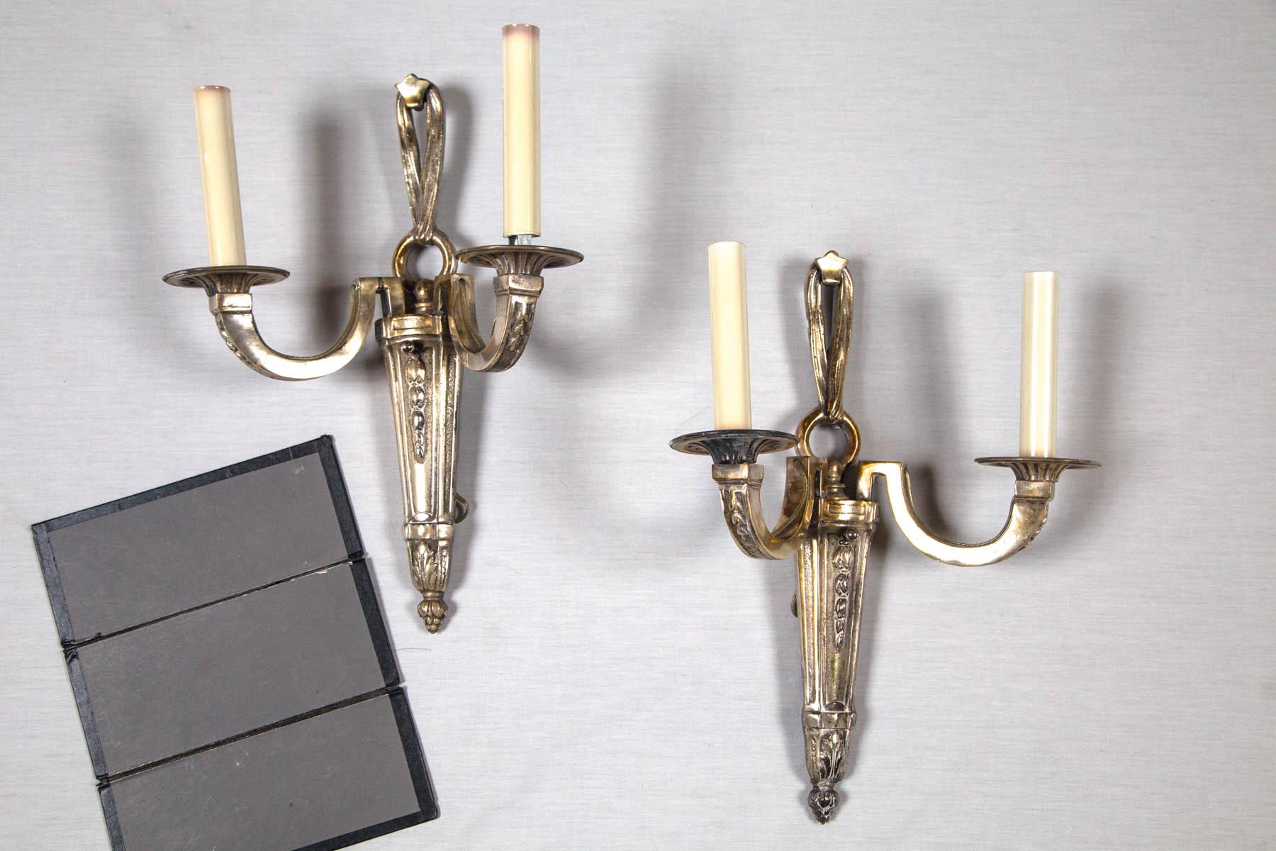 A fine original pair of E F Caldwell silvered bronze sconces dating from the year 1900. Having crisp detailed quality and original silver patina.