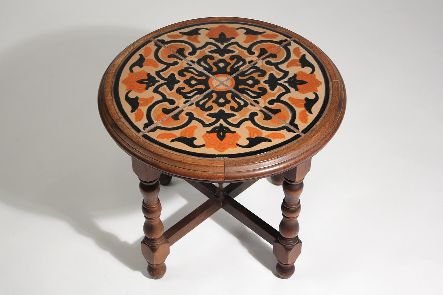 Beautiful original antique California Mission Taylor wood and tile top table dating from the 1920s. Has 4 beautiful tiles inlaid into a wooden table. In nice original condition with great color. Rare circle shape and color.