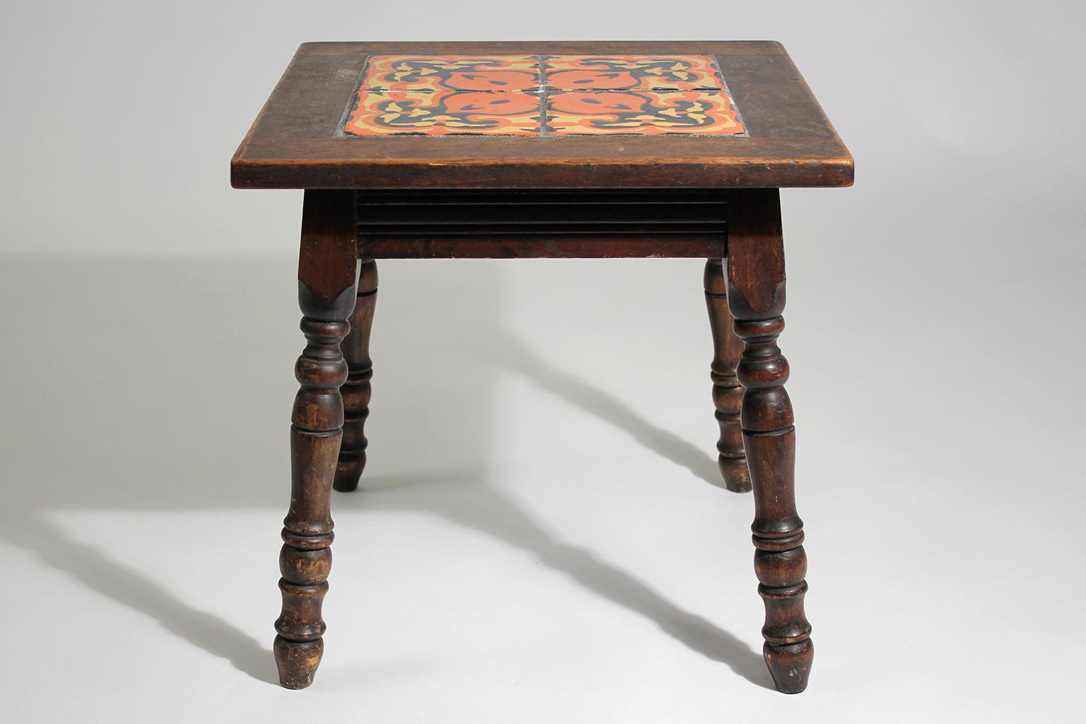 Beautiful original antique California Mission Taylor Malibu wood and tile top table dating from the 1920s. Has 4 beautiful tiles inlaid into a wooden table. In nice original condition with great color.
