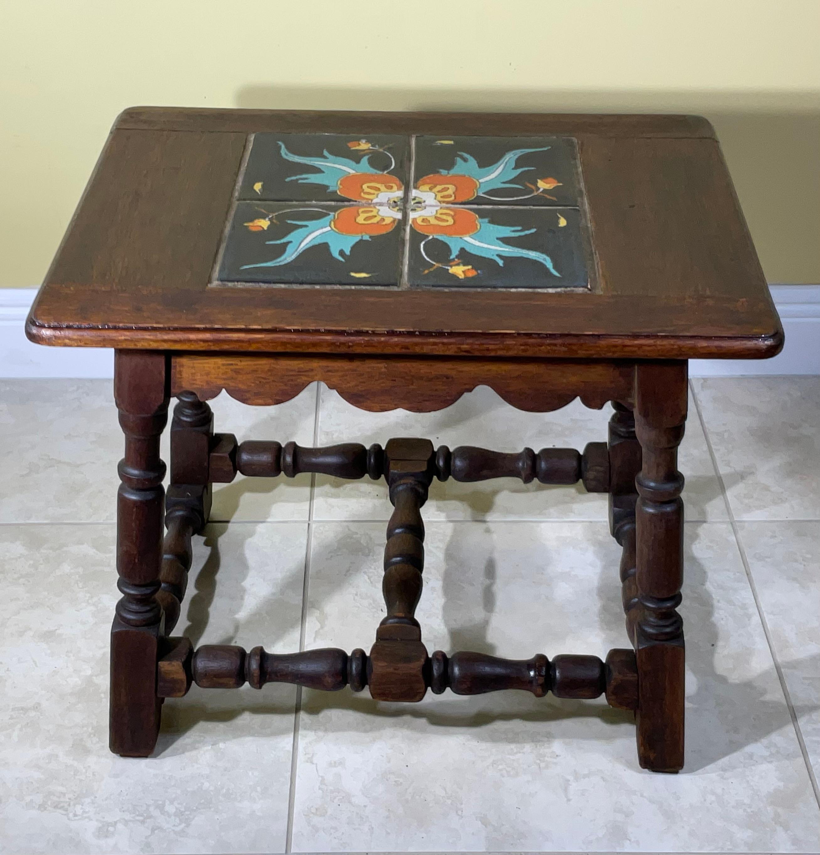 Elegant California table ,with beautiful  set of four ceramic tile top ,great hand painted colors set beautifully in walnut frame, total top tiles measure 12”x 12”   Good  condition, newly professionally refinished, a few small edge chips, as shown.