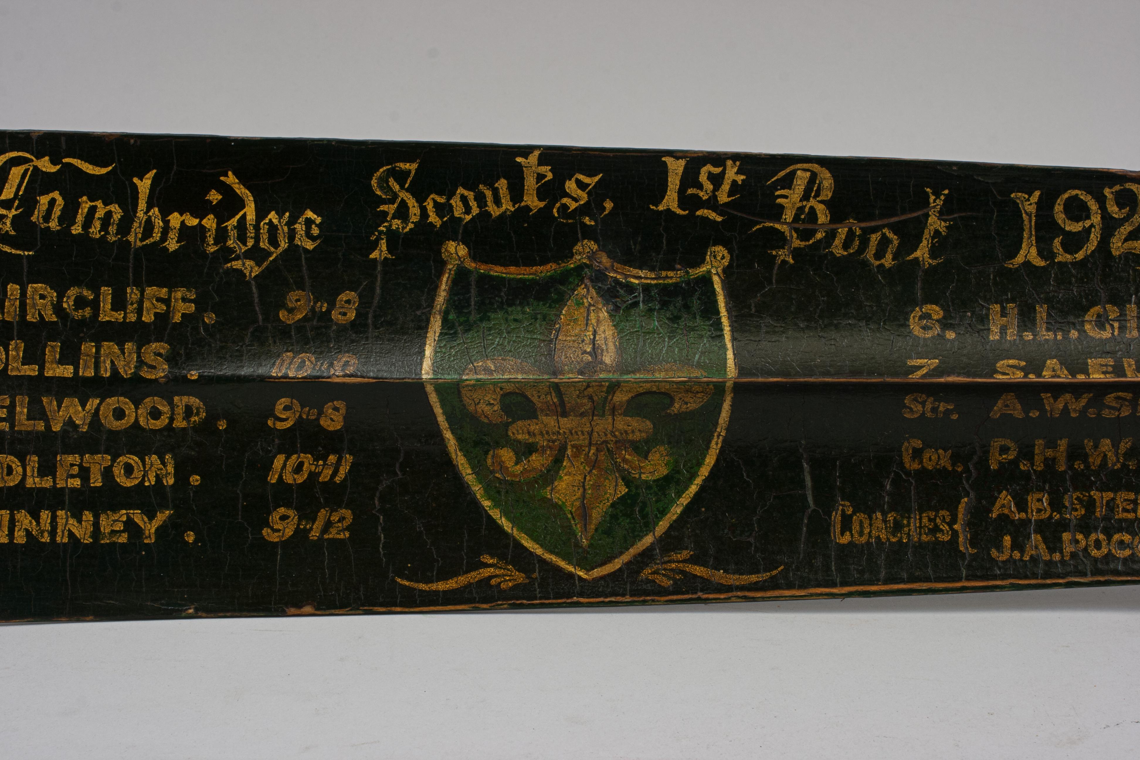 Cambridge Scouts 1st Boat Presentation Rowing Oar.
The full-length oar is an original traditional presentation rowing oar with gilt calligraphy, the crew's names and weights and the Scouts emblem. The Cambridge Scout Boat Club was formed in 1923 and