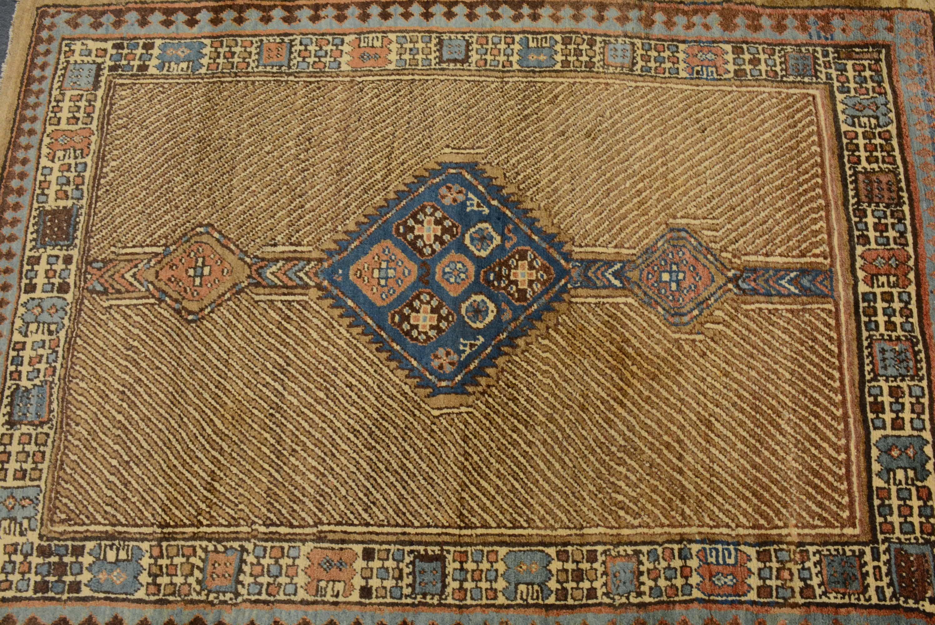 The town of Bakshaish is located in the mountainous Heriz region of Northwest Persia, and is generally accepted to be the oldest weaving village in this district. It is noted for producing carpets that display bold abstract interpretations of the