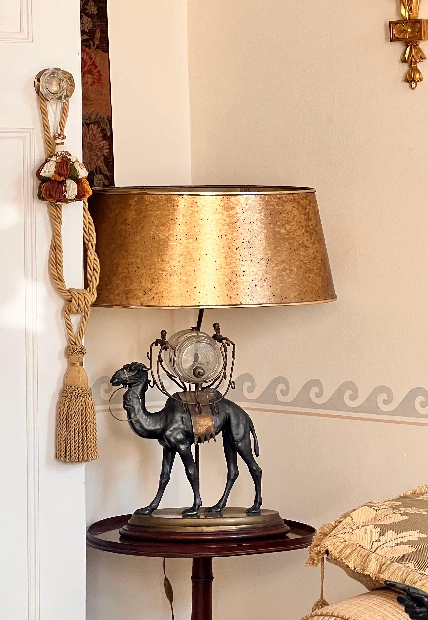 A very decorative Napoleon III period patinated spelter figure of a camel carrying a glass barrel, now mounted as table lamp.
France, circa 1860's–70's.

Why we like it
Wonderfully sculptural and exotic, redolent of the oriental exuberance, this