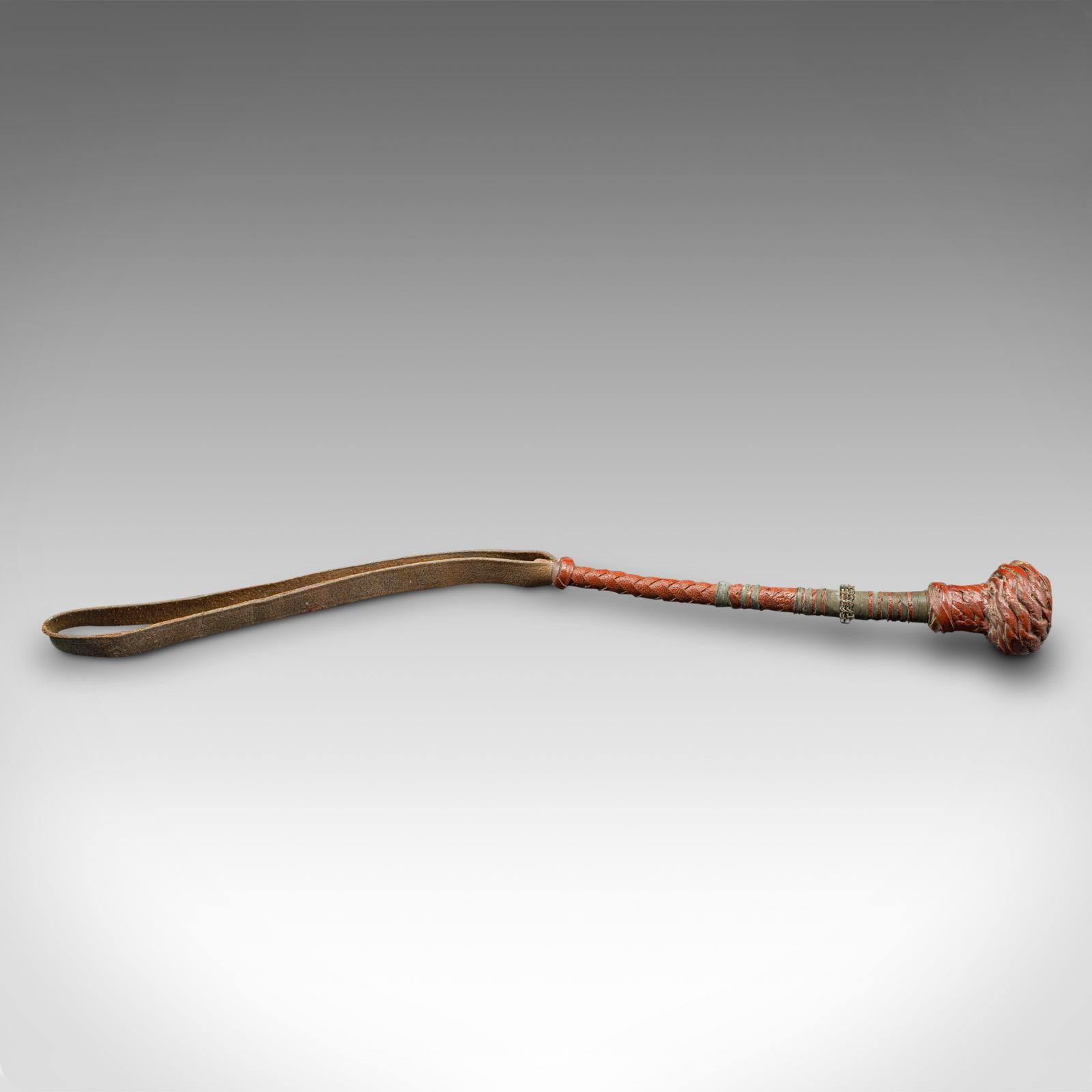 This is an antique camel whip. An Arabic, leather rider's crop, dating to the late Victorian period, circa 1900.

Fascinating leather whip, with appealing colour
Displays a desirable aged patina throughout
Woven leather handle tanned to a warm