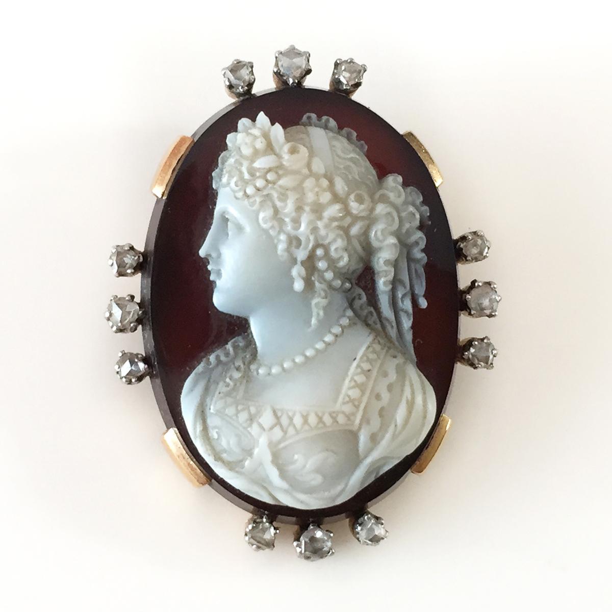Antique hand carved Cameo on oval sardonyx plate brooch / pendant with 18k yellow gold frame surrounded by 3 from four sides old rose cut antique diamonds. Made in France. Circa 1838. Weight 17.33 grams. The Cameo is carved in high relief with a