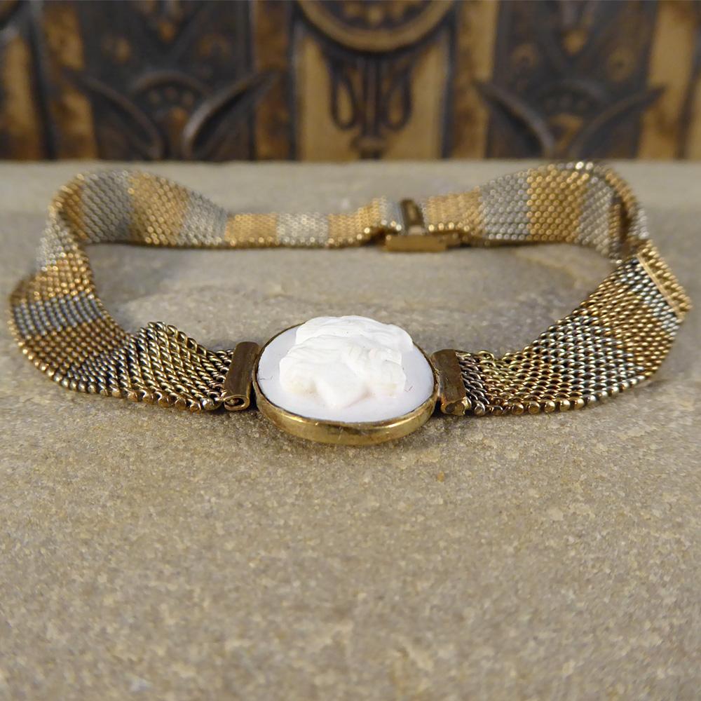 This Edwardian mesh bracelet has been set in two colour gold. It is adjustable making it wearable for most size wrists, and features a white cameo set in gold!


Condition: Very Good, slightest signs of wear due to age and use

Defects: None

Date /